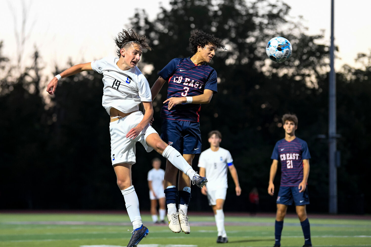 Central Bucks South’s Evan Jaskelewicz and Central Bucks East’s Jeremy Salazar battle a header.