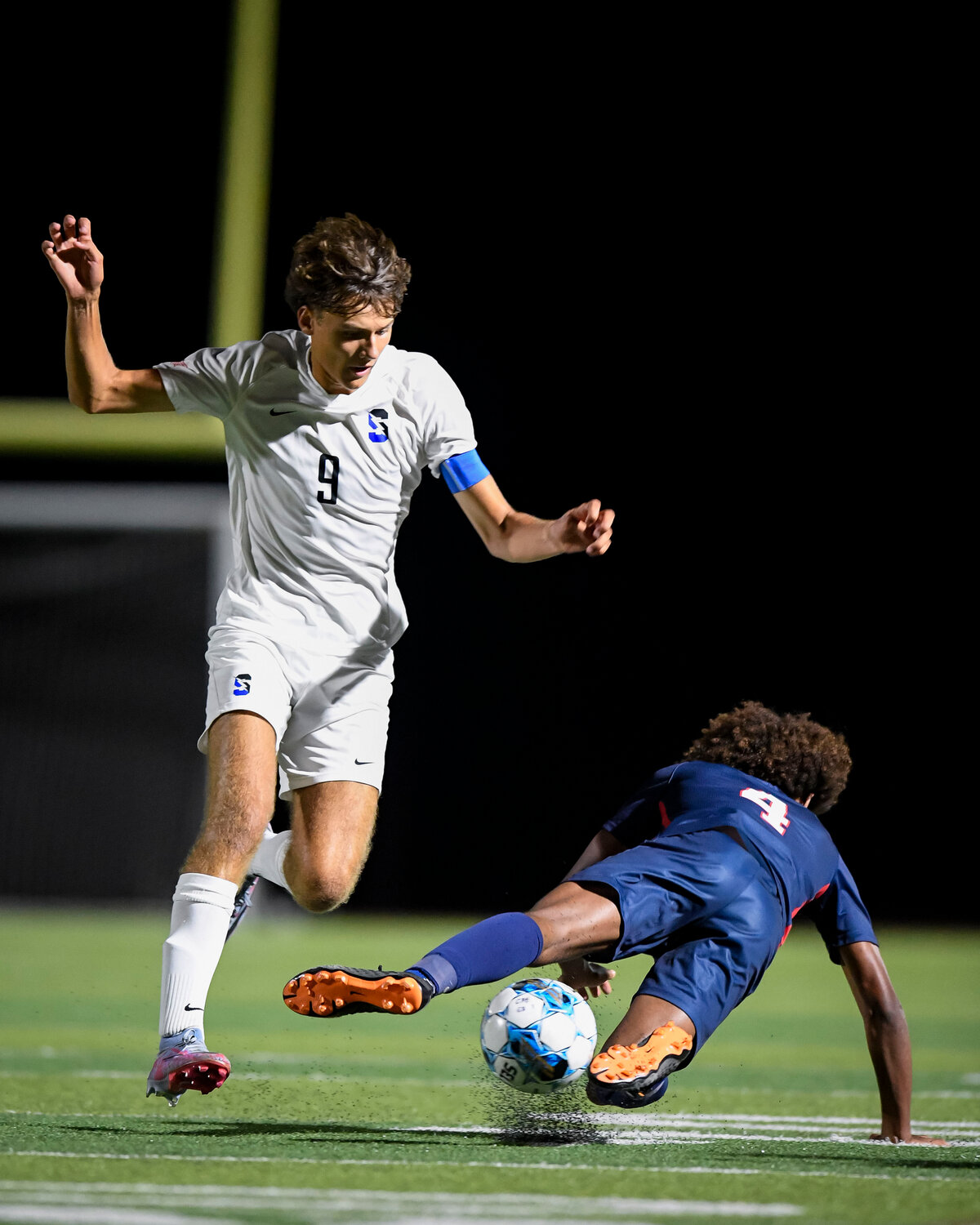 Central Bucks South’s Pat Chrzanowski fouls Central Bucks East’s Koen Reid while attempting to clear the ball.