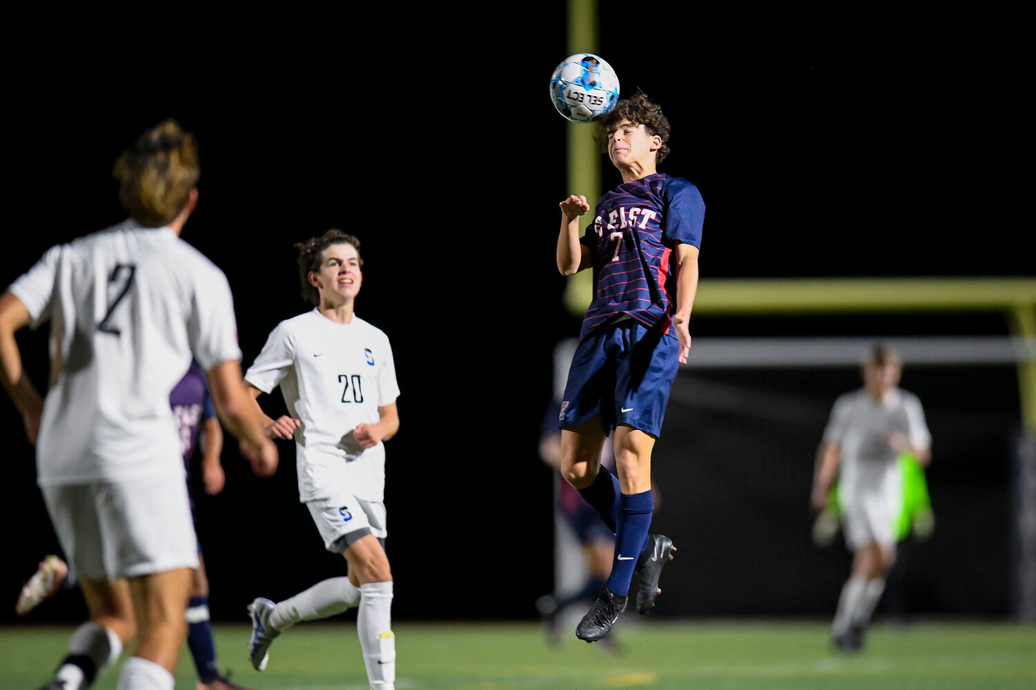 Central Bucks East’s Aidan Pasternak directs a header in the second half of the 3-0 East win.