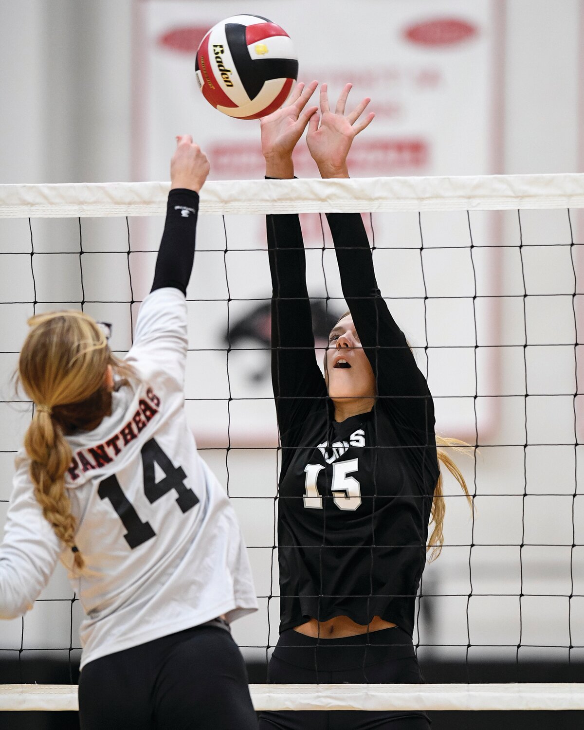 Faith Christian’s Jadyn Personett goes up to block the spike of Plumstead’s Ava Spiaggia.