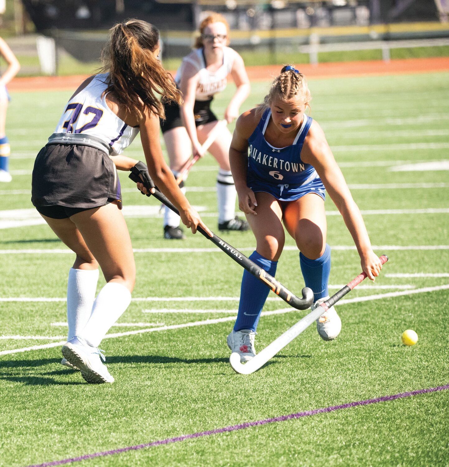 Quakertown’s Kaitlin Calvello and Palisades’ EllyAna Phibbs battle for the ball.