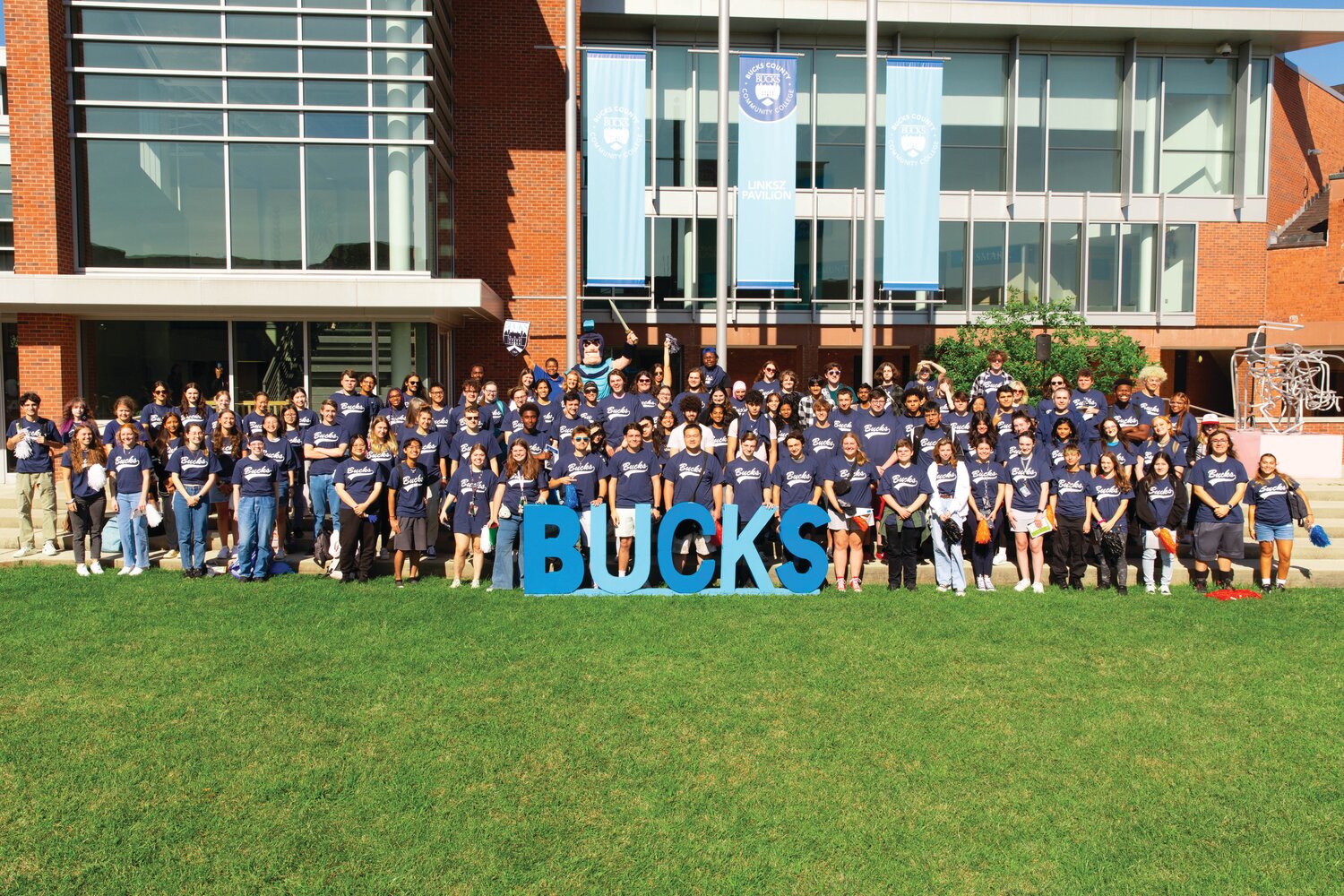 Some of this fall’s new students gather on the quad along with President Dr. Felicia Ganther (back row) to celebrate the start of their academic journeys at Bucks County Community College’s Newtown Campus.