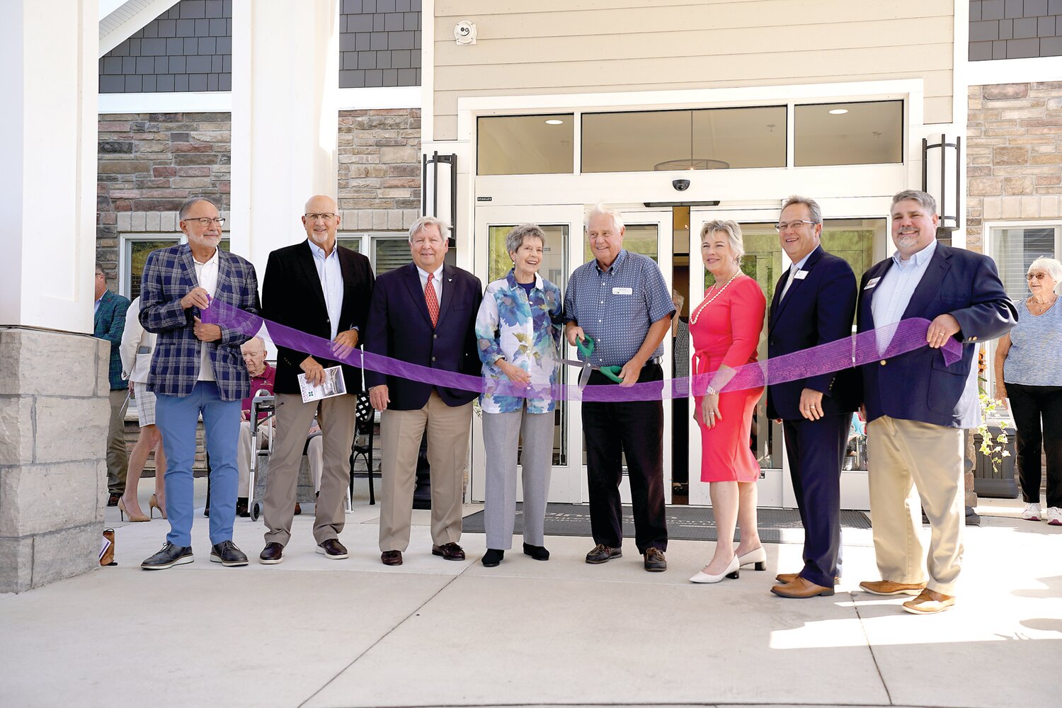 A ribbon-cutting ceremony in front of the Pine Run Village Community Center is attended by The Villagers (residents of Pine Run Village), board members from Doylestown Health, PSL board members, and leadership teams from both PSL and Pine Run Village.