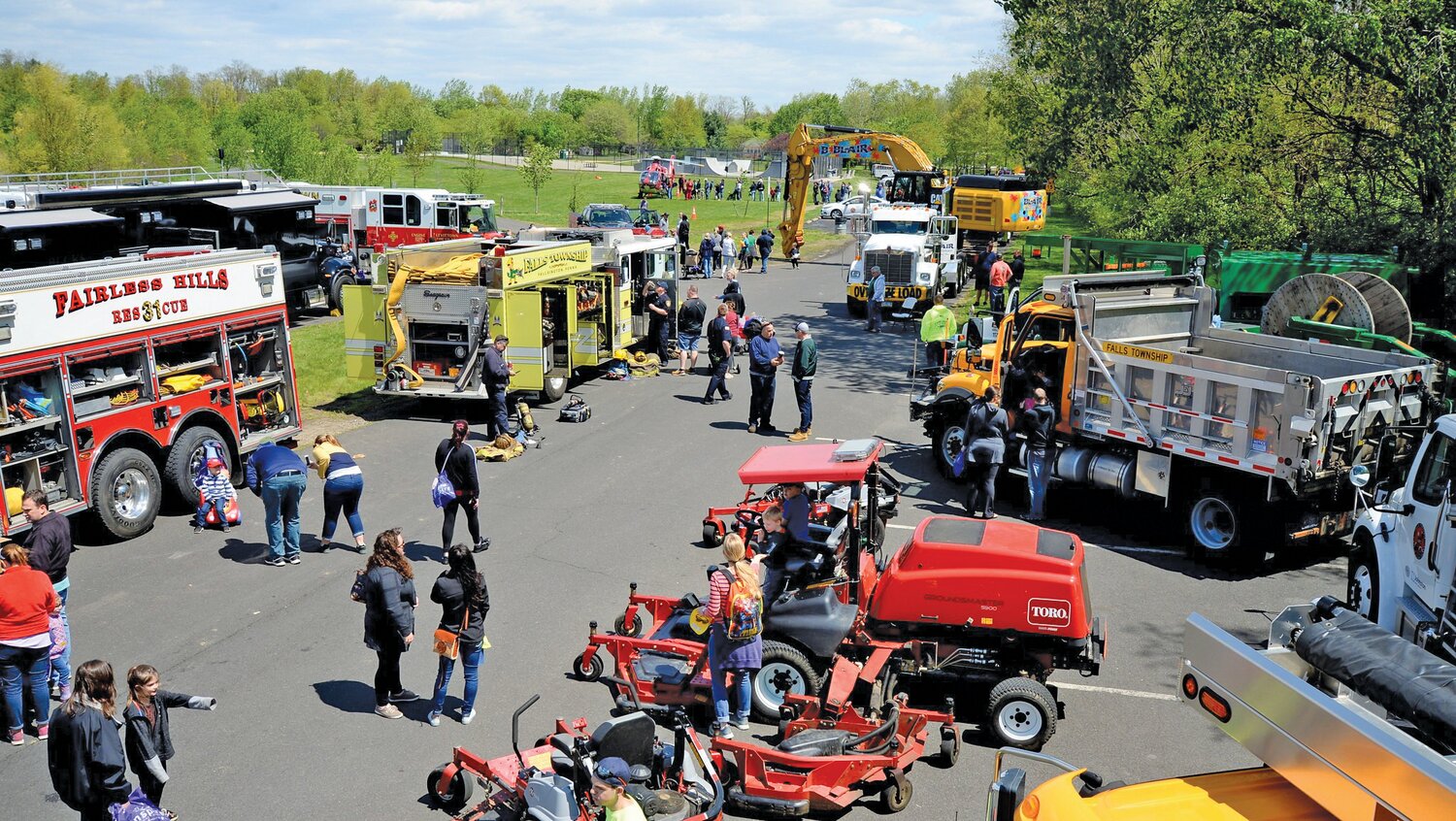 Visitors walk among the trucks on display during a previous Touch a Truck and Family Festival in Falls Township.