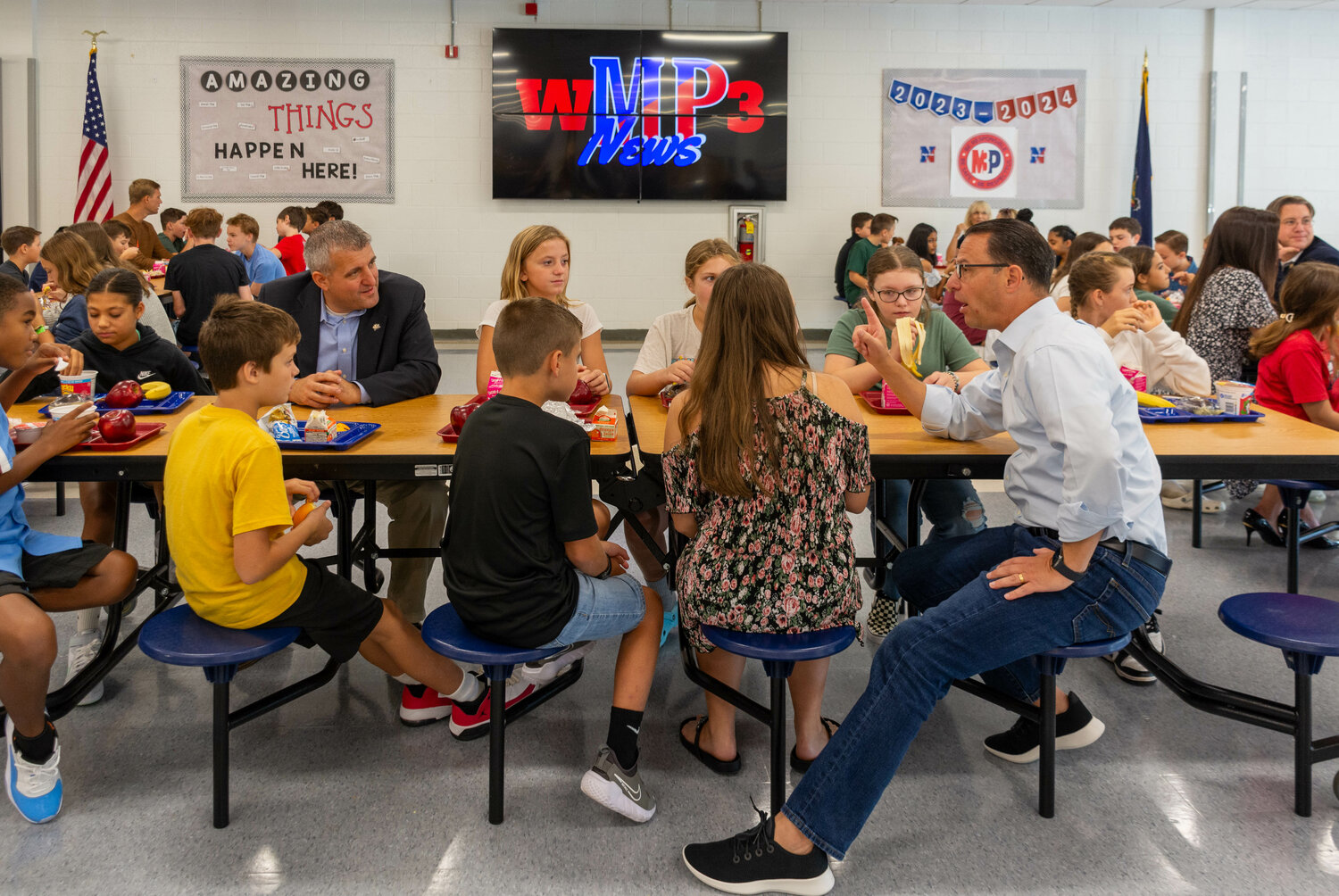 Gov. Josh Shapiro, a Democrat, and state Sen. Frank Farry, R-6, converse with students at Maple Point Middle School on Friday.