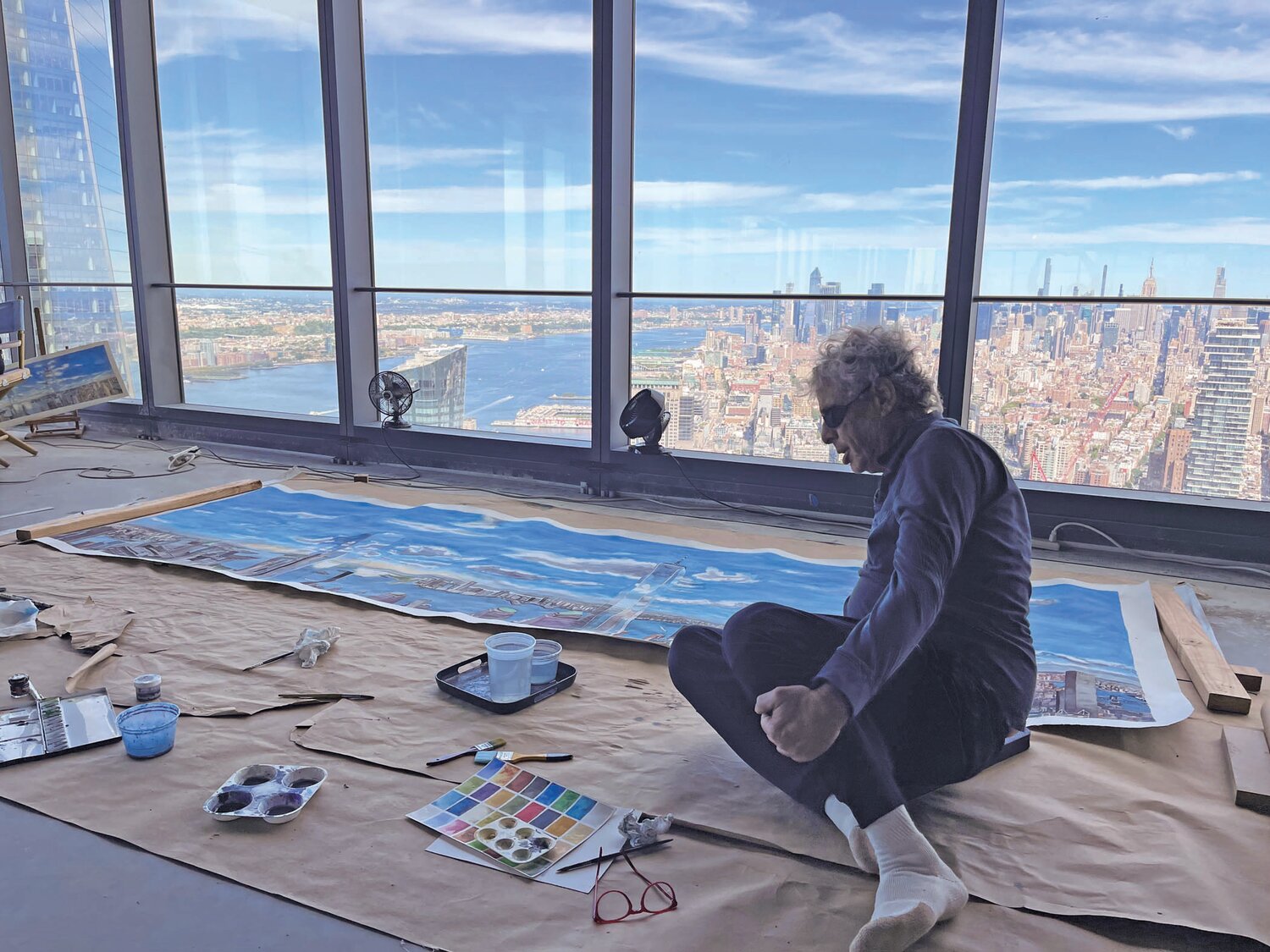 Artist Todd Stone, who lives in Manhattan and Nockamixon Township, sits in his studio on the 71st floor of 3WTC, where he has been working on a series of paintings of the panoramic view.