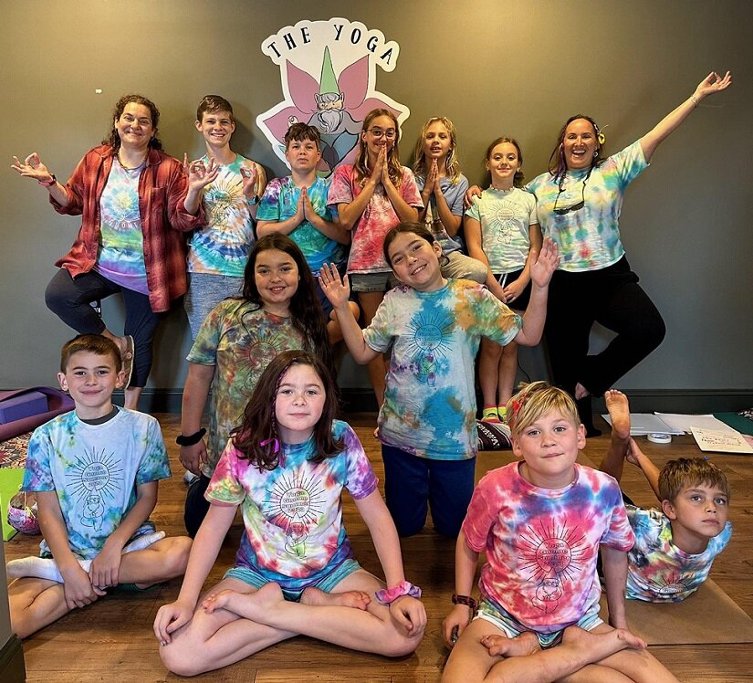 Elizabeth Kornberg, top left, and Adi Strigl, top right, strike their poses with students at The Yoga Gnome, which Strigl founded to help children stay grounded and centered as they emerge from pandemic lockdowns.
