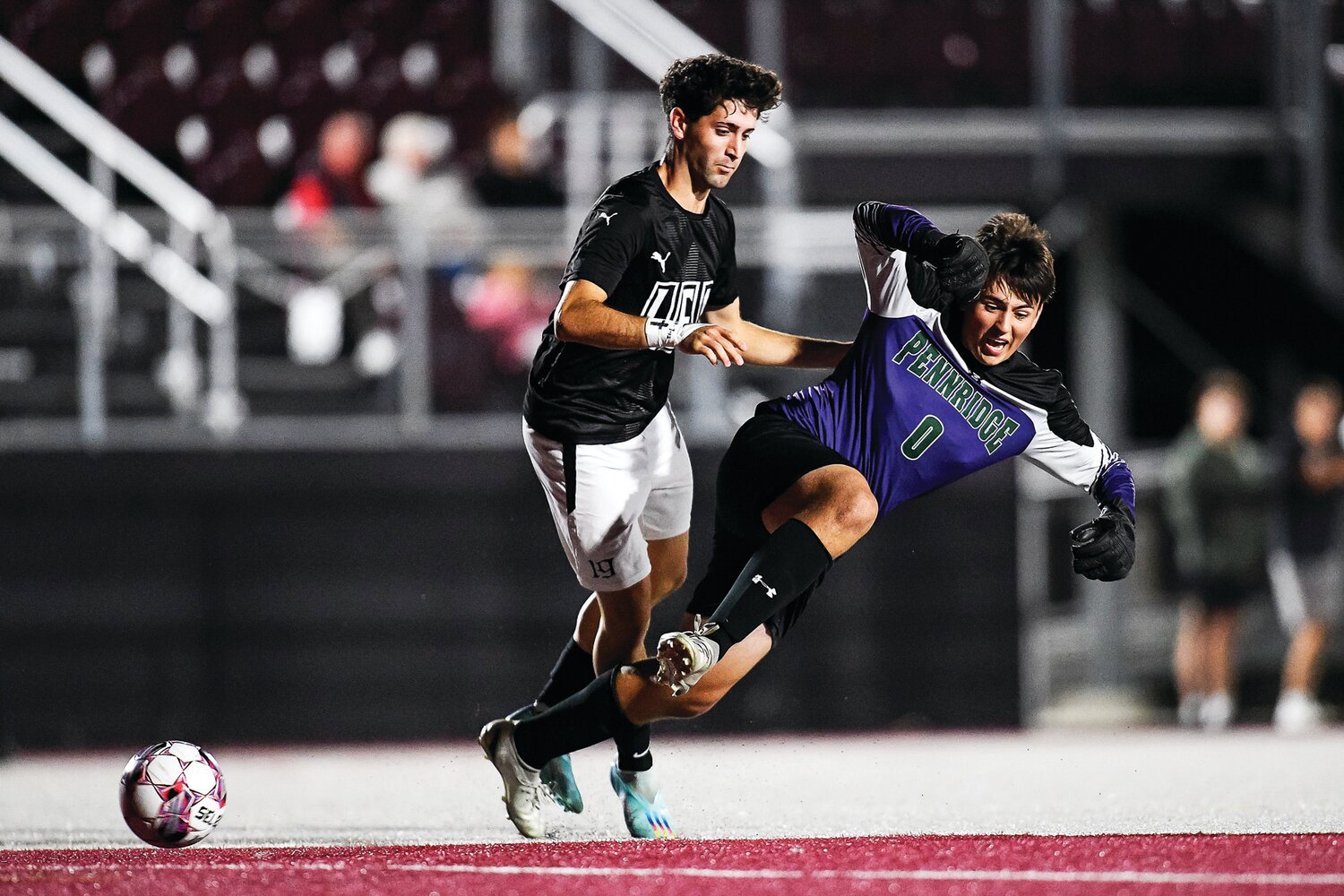 Faith Christian’s Jamie Ferrandis steals the ball from Pennridge goalie Gavin Dimmick in the first minutes of the game, leading to a goal by Logan Moore and a 1-0 lead.