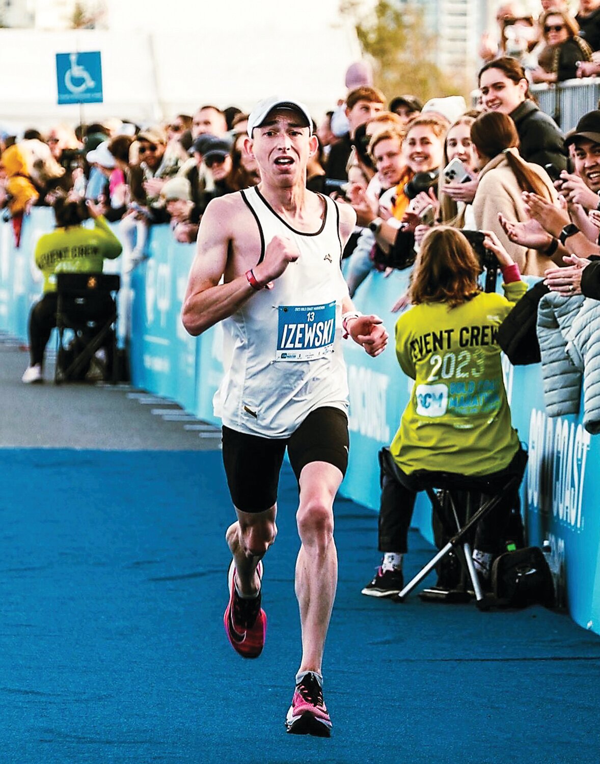 Josh Izewski crosses the finish line at the Gold Coast Marathon.