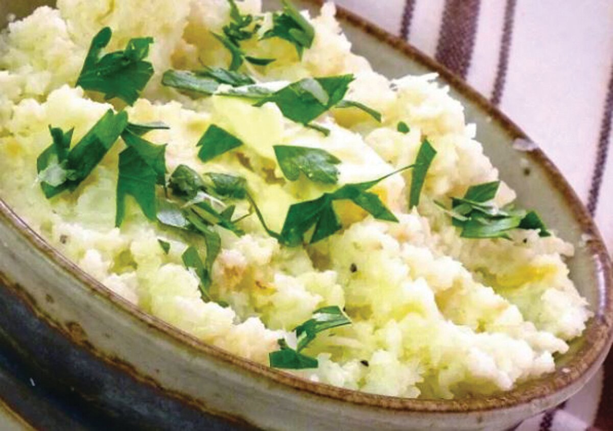 Cauliflower is mashed and seasoned in this recipe and can serve as a low-calorie substitute for mashed potatoes.