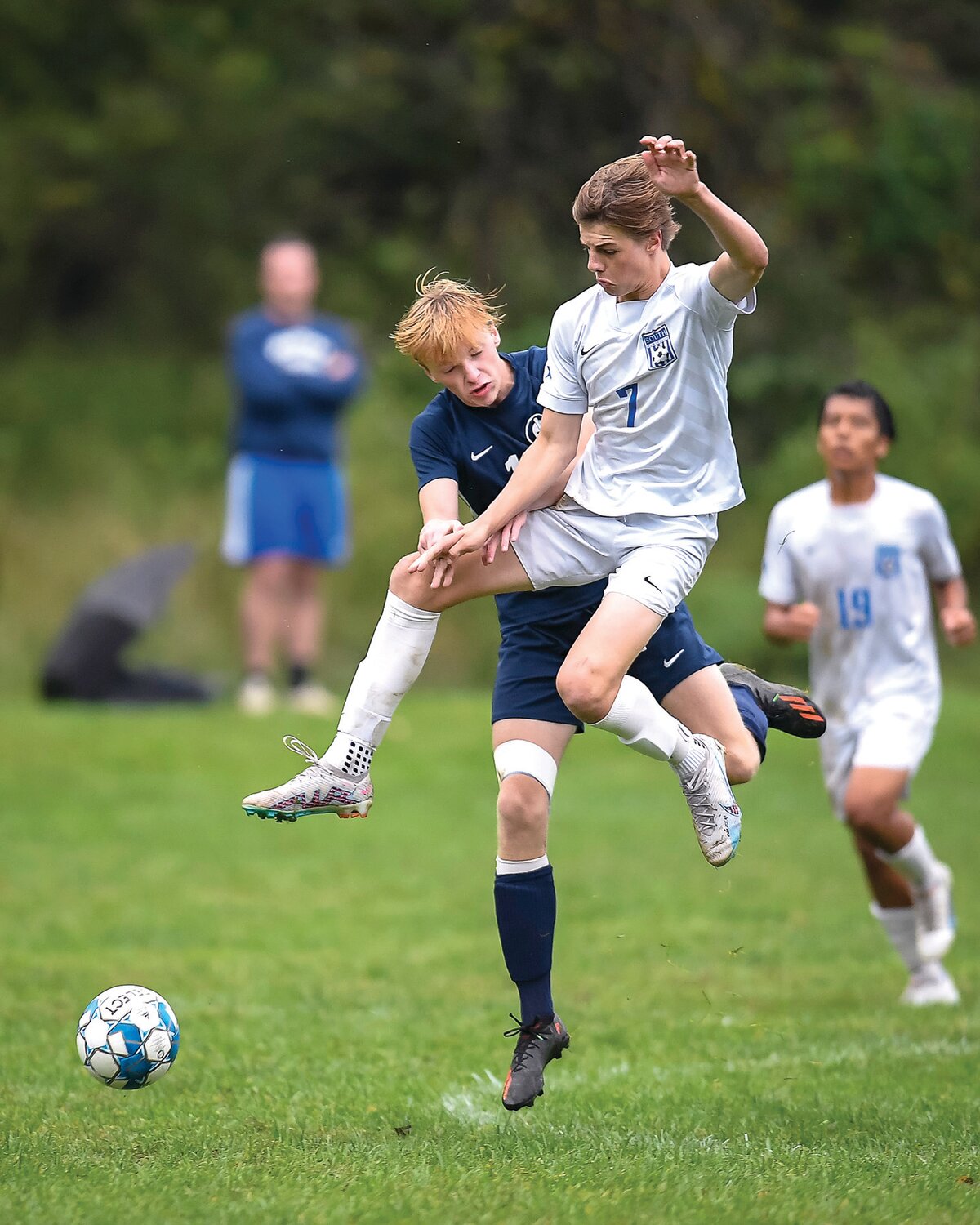 South Hunterdon’s Ollie Horan collides with Solebury School’s Emmitt Caruso while chasing a midfield pass.