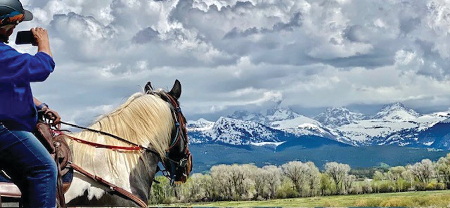 Linda Jenny and Roxy were riding in Idaho when they saw this view of the Grand Tetons.
