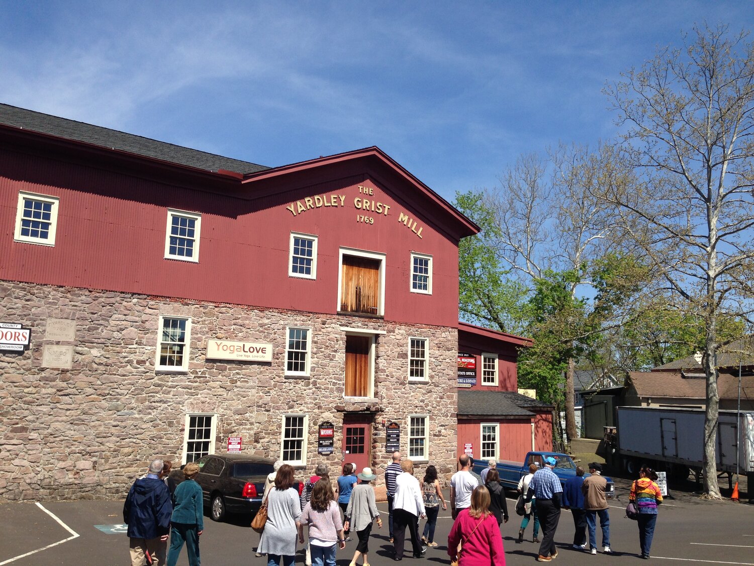 A Yardley walking tour passes by the old Yardley Grist Mill in 2016.