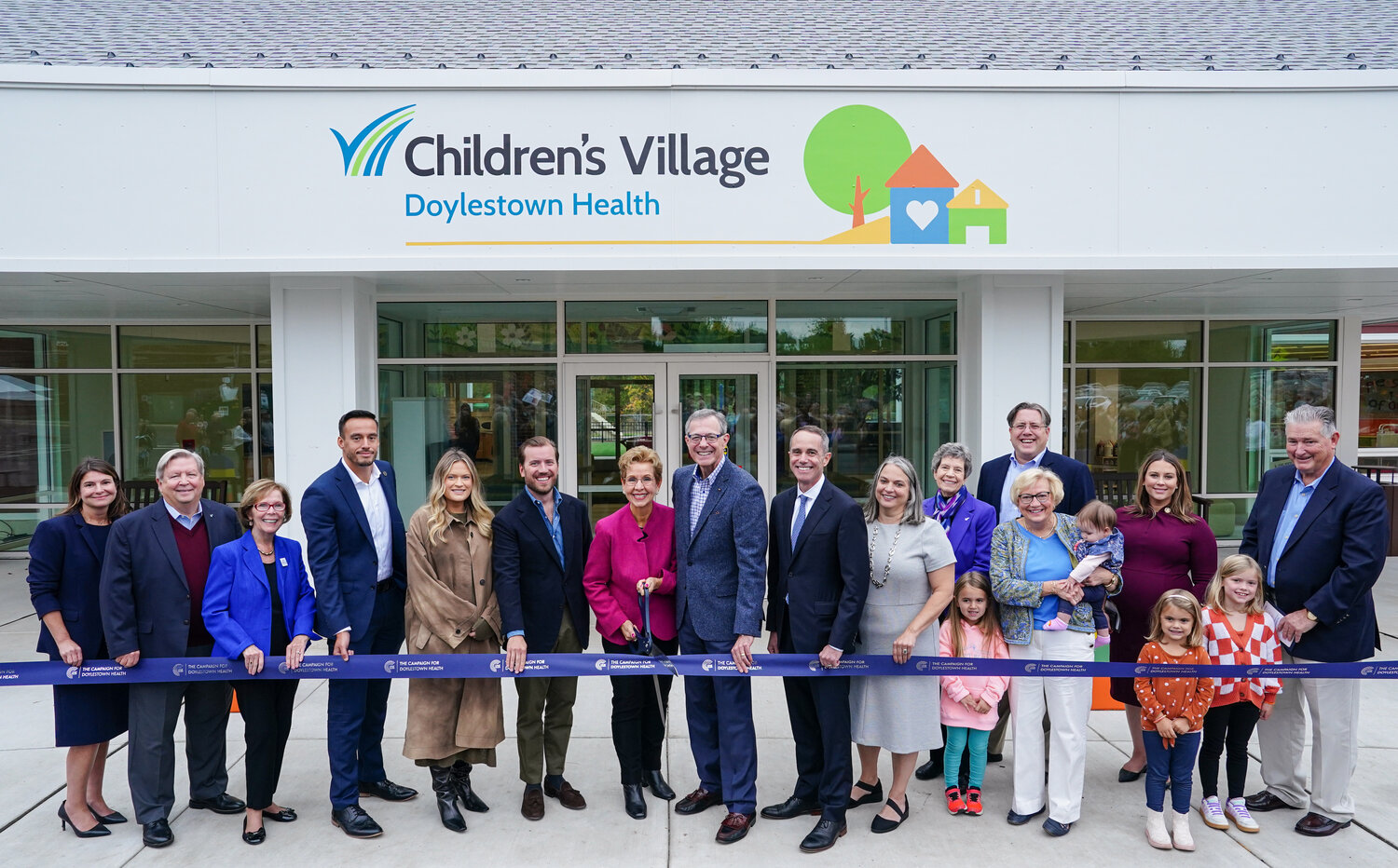 From left to right, Doylestown Health VP and Chief Advancement Officer Laura Wortman, President and CEO Jim Brexler, VIA President Helen Hammes, District Director for U.S. Rep. Brian Fitzpatrick, Kyle Melander, Children’s Village Leadership Donors Haley Torrey and Nick Gorsky, Jeanne Hubbard, John Hubbard, State Sen. Steve Santarsiero, Children’s Village Director Bernadette Rodrigo, Chair of the Boards, Doylestown Hospital and Doylestown Health Foundation, Marianne Chabot, VP and Chief Human Resources Officer Barbara Hebel (with grandchildren, who are Children’s Village students), state Rep. Tim Brennan, state Rep. Shelby Labs, and Director of Integrated Services Ernie Werner (with grandchildren, who are Children’s Village students).