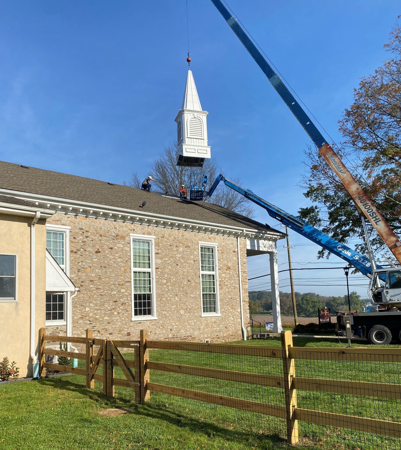 A crew from Campbellsville Industries Inc., “The Steeple People” of Campbellsville KY, prepare to install the Forest Grove Presbyterian Church’s new steeple.