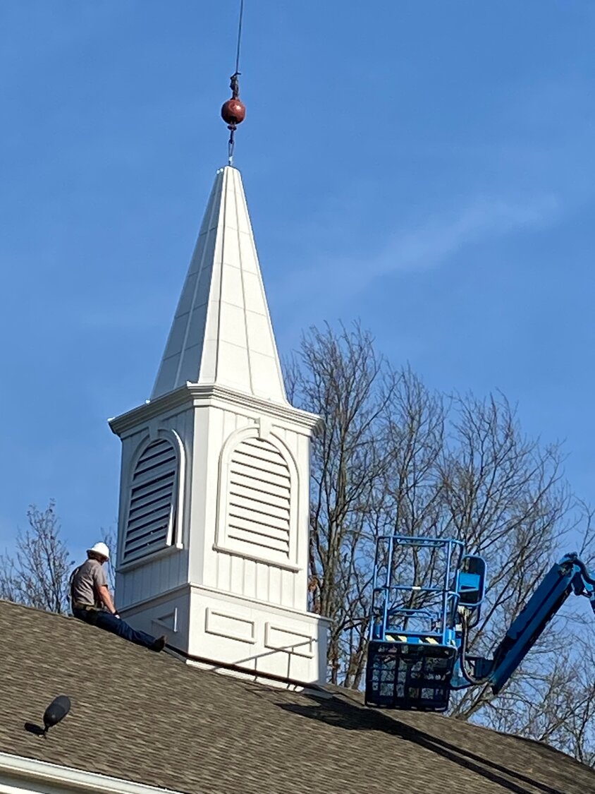 The new steeple sits atop Forest Grove Presbyterian Church in Buckingham Township.