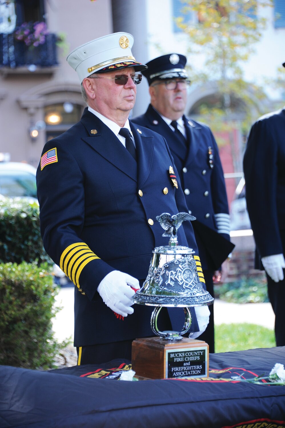 Bucks County Fire Marshal John Gundy tolls the bell.