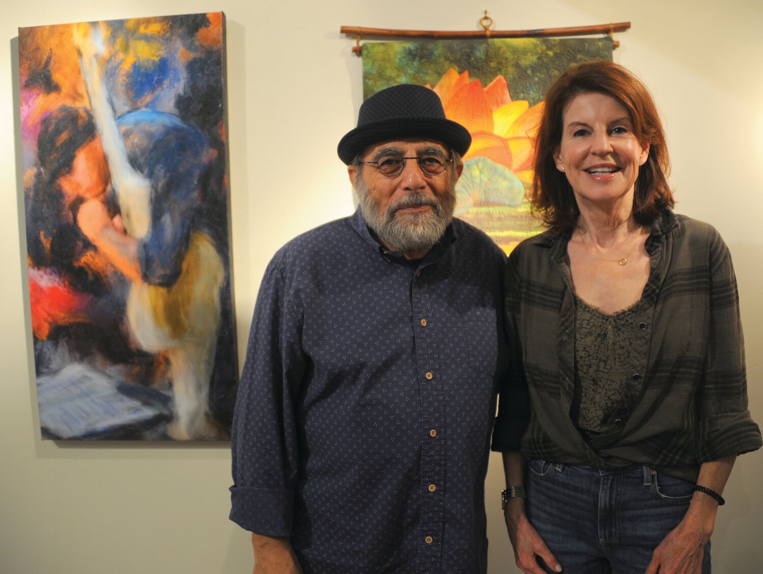 Artist Joseph Schembri with his work, “The Bottom Line,” and Lynne Brennan.