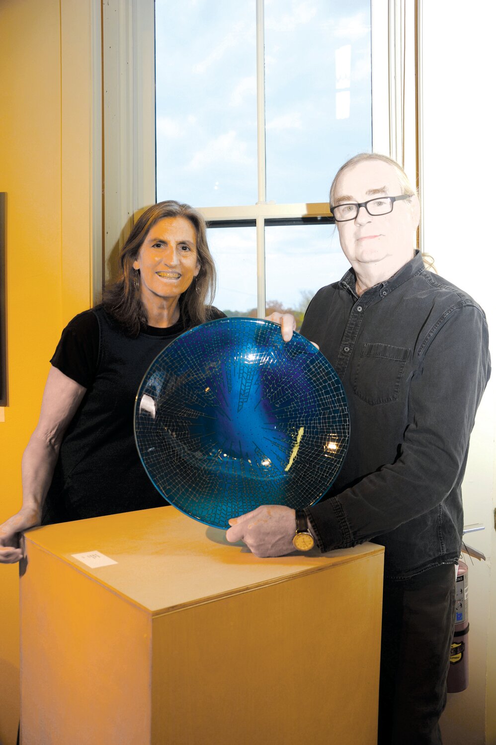 Susan Wallner and Mark Kobasz with his glass artwork, “Open Sky.”