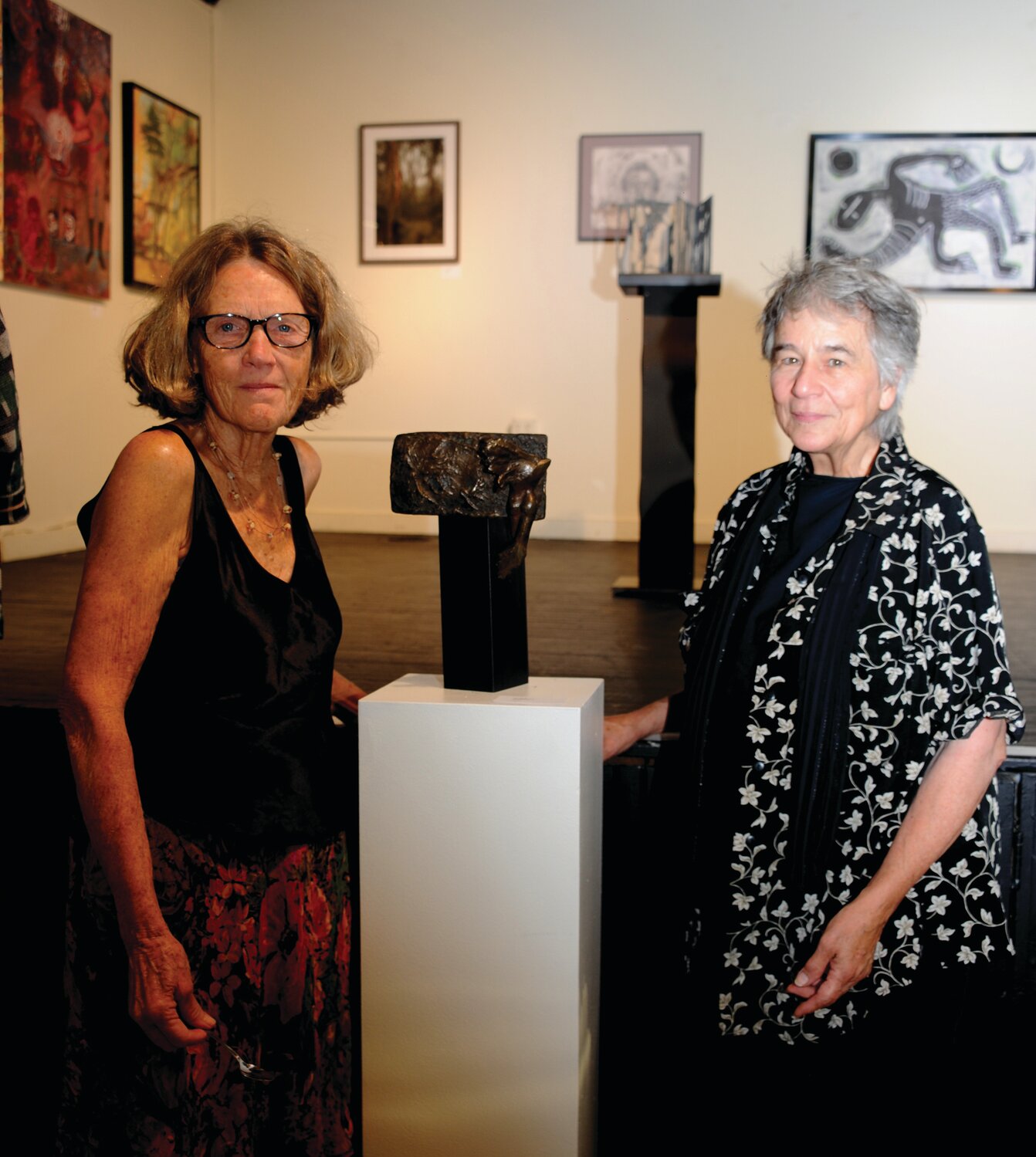 Carol Cruickshanks, director of New Hope Arts, and Jen Wyatt with her piece,“Transformation.”