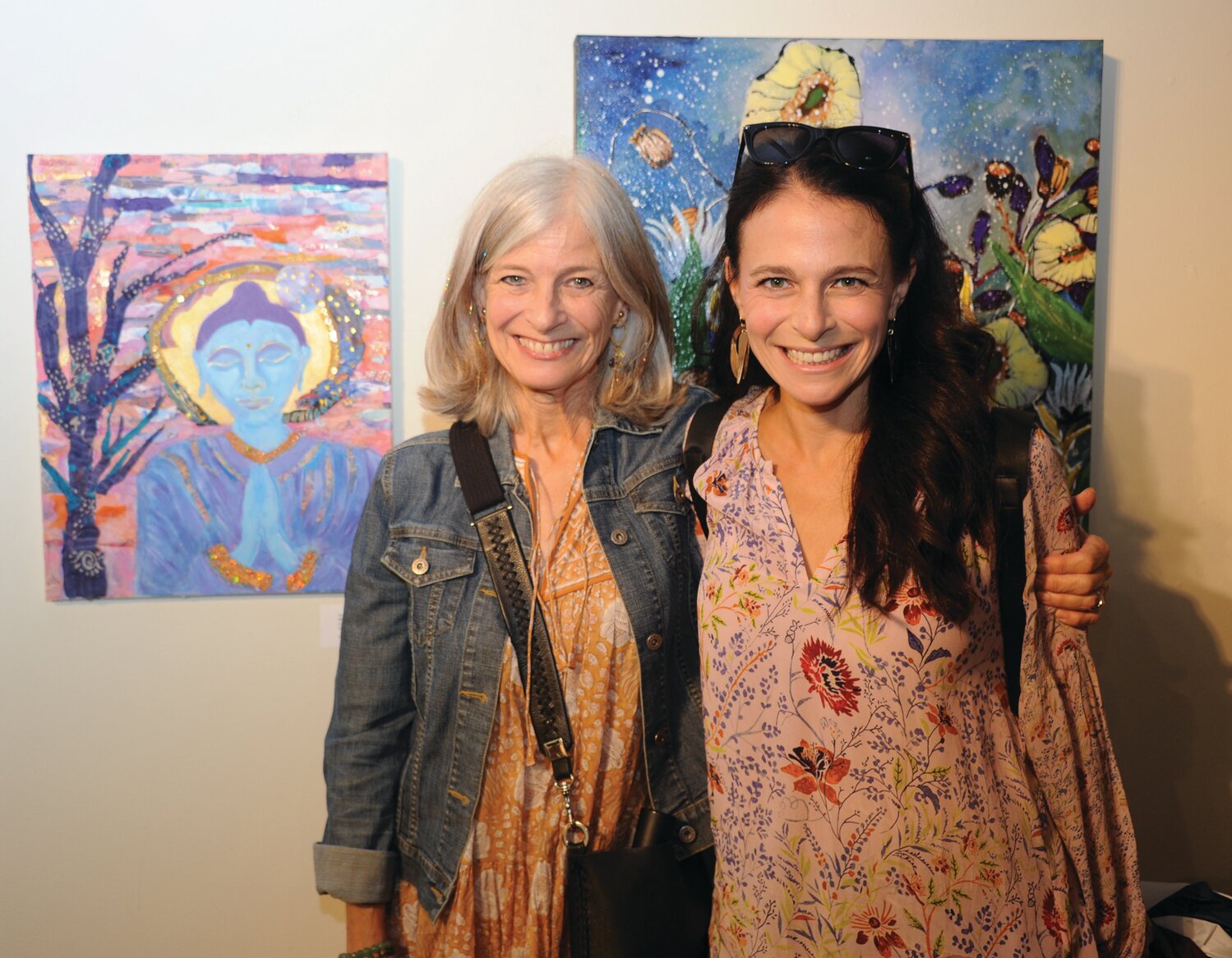 Artist Karen Engelmeyer with her work “Wings of the Heart” and daughter Katy Corrigan.