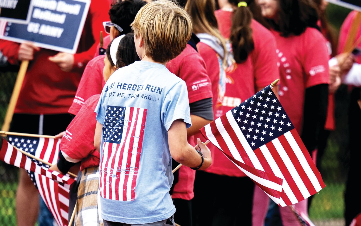 Young people prepare to cheer on participants in Sunday’s 9/11 Heroes Run at War Memorial Stadium in Doylestown.