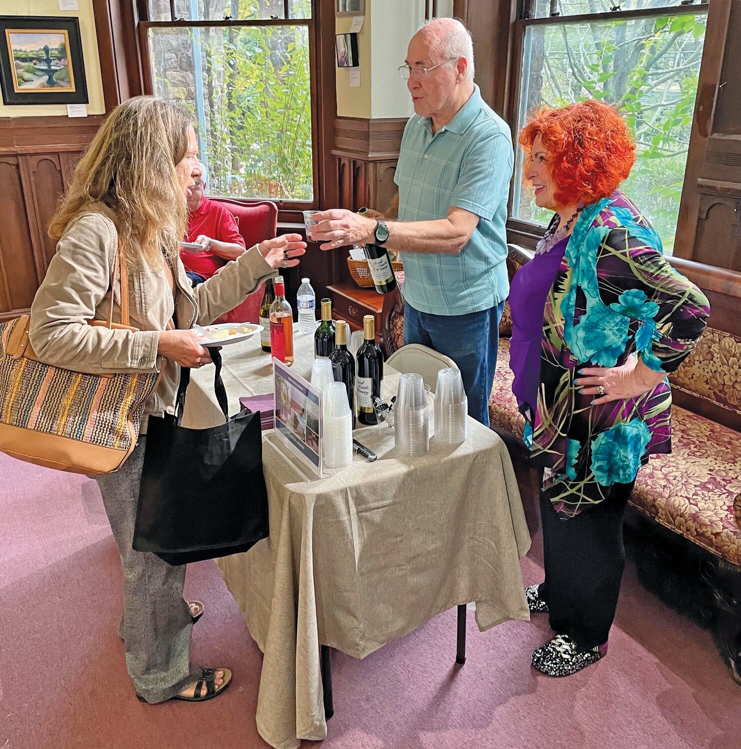 Chuck and Pearl Mintzer of New Hope volunteered at the Wine & Art Trail Exhibition, pouring wine from Sand Castle Winery.