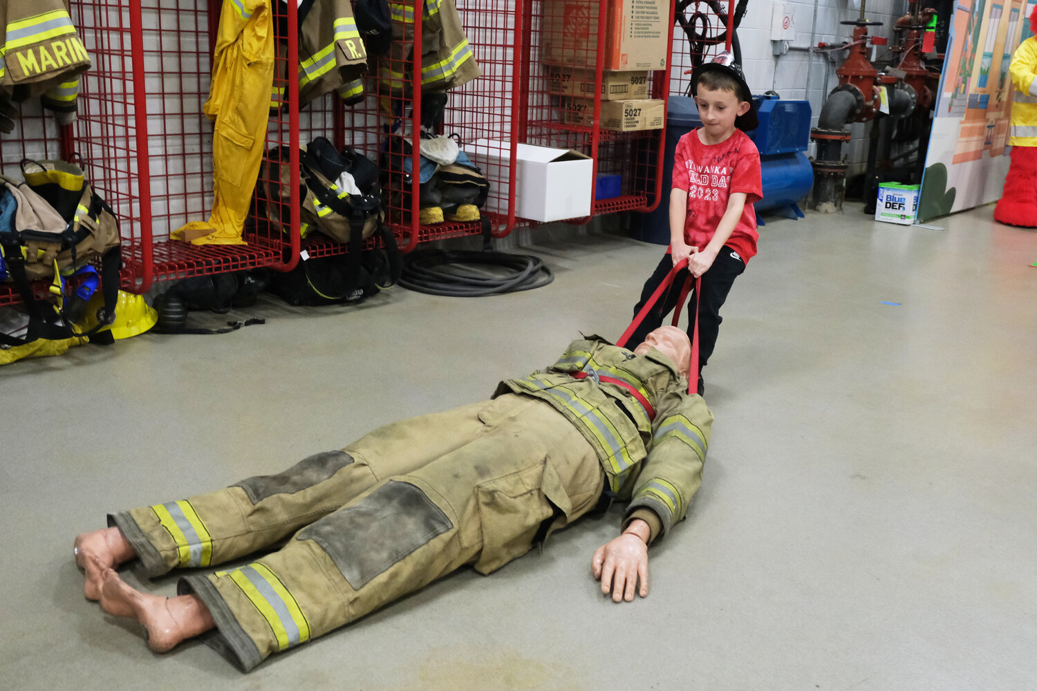 Eight-year-old Jude Todd does the body drag at Langhorne-Middletown Fire Company Station 22.