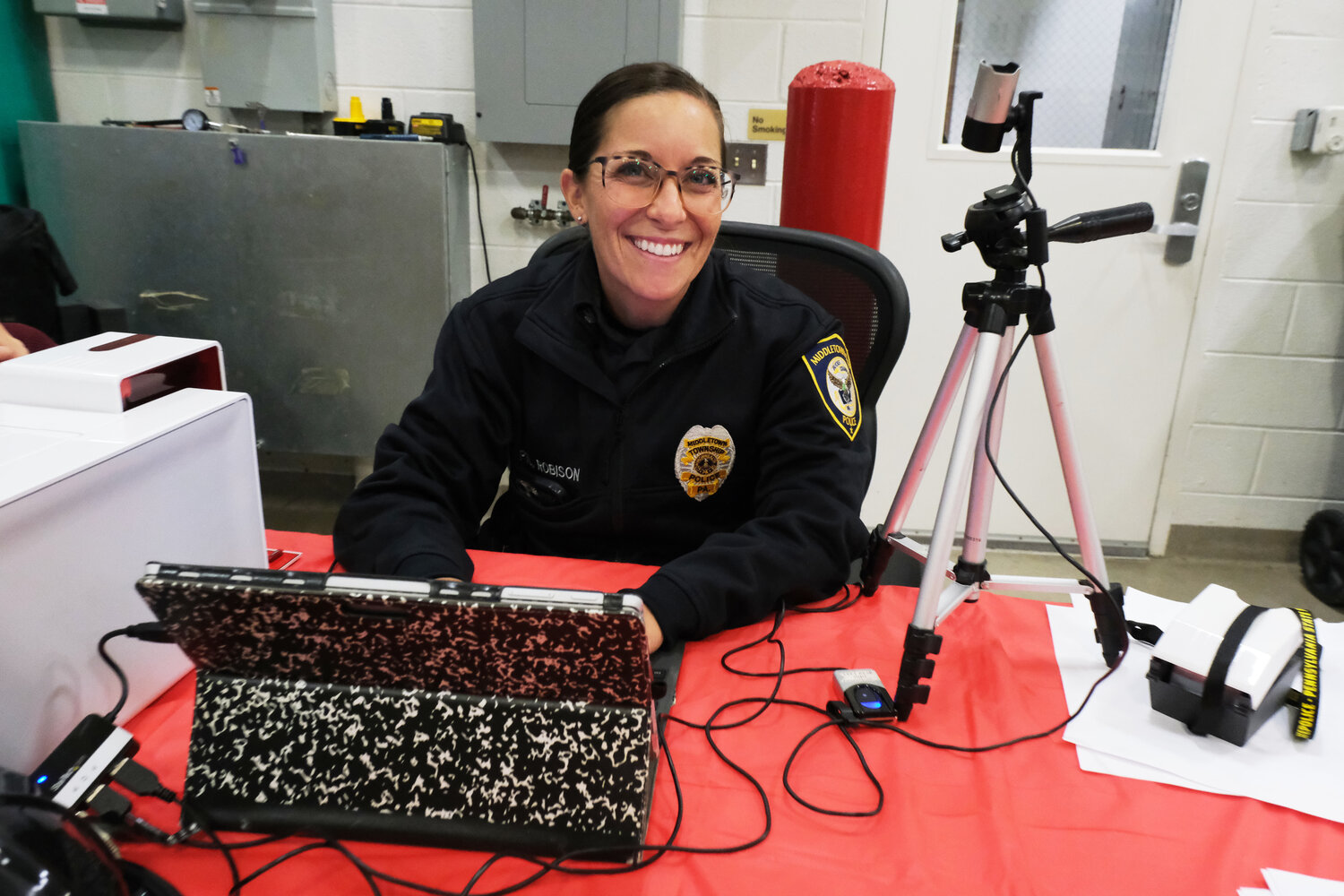 Officer Melissa Robison makes ID cards for the children that attended the Oct. 12 open house at Langhorne-Middletown Fire Company.