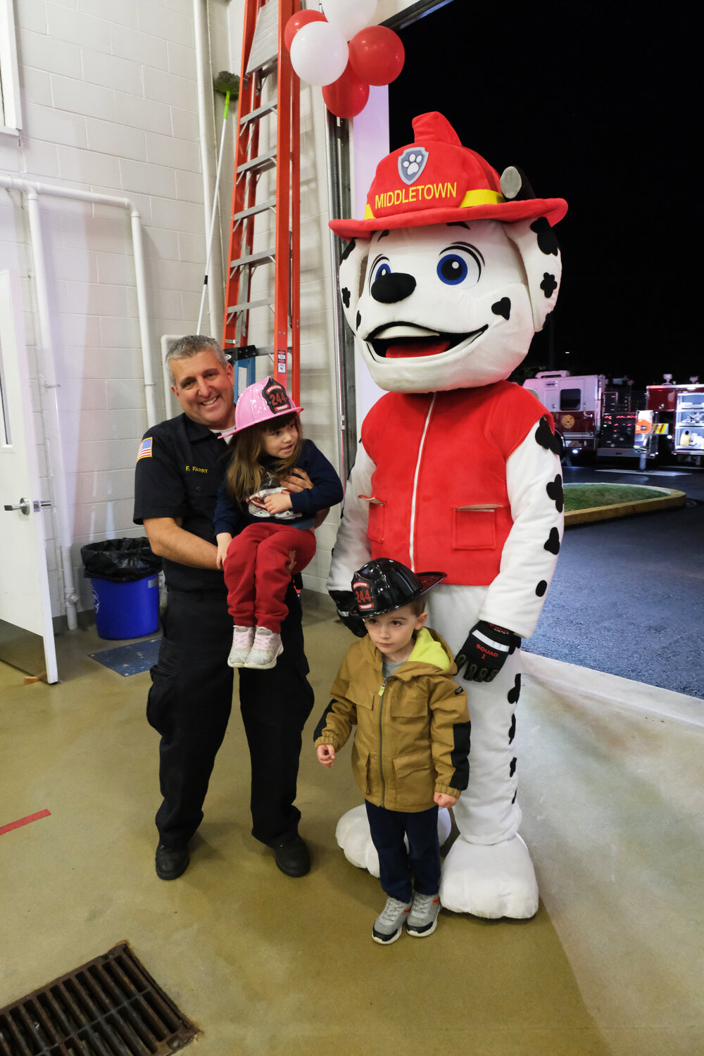 Fire Chief and PA Senator Frank Farry poses with his children and Marshall from Paw Patrol.