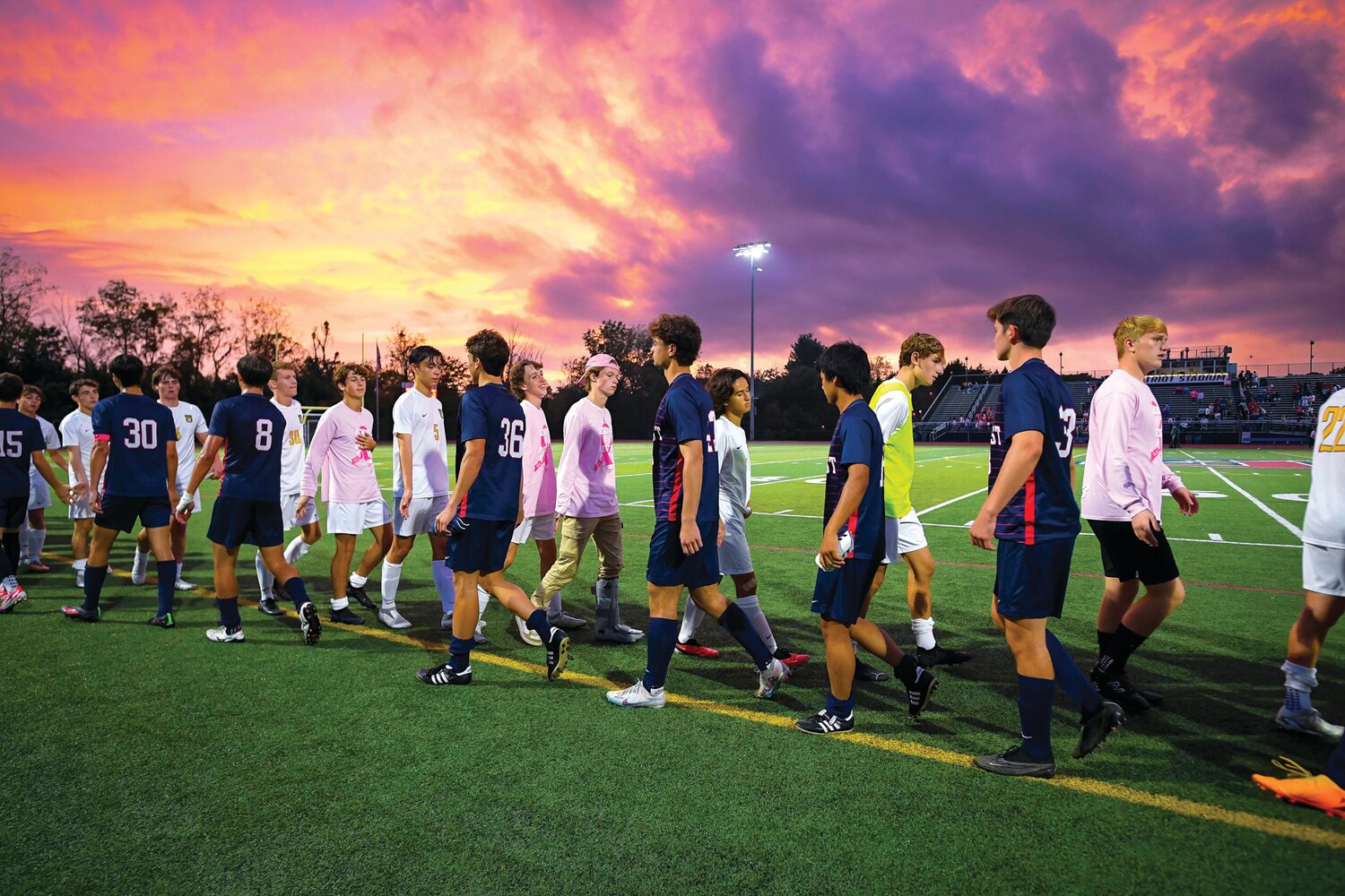 Players from the East and West boys soccer teams shake hands after East’s 2-0 victory over West.