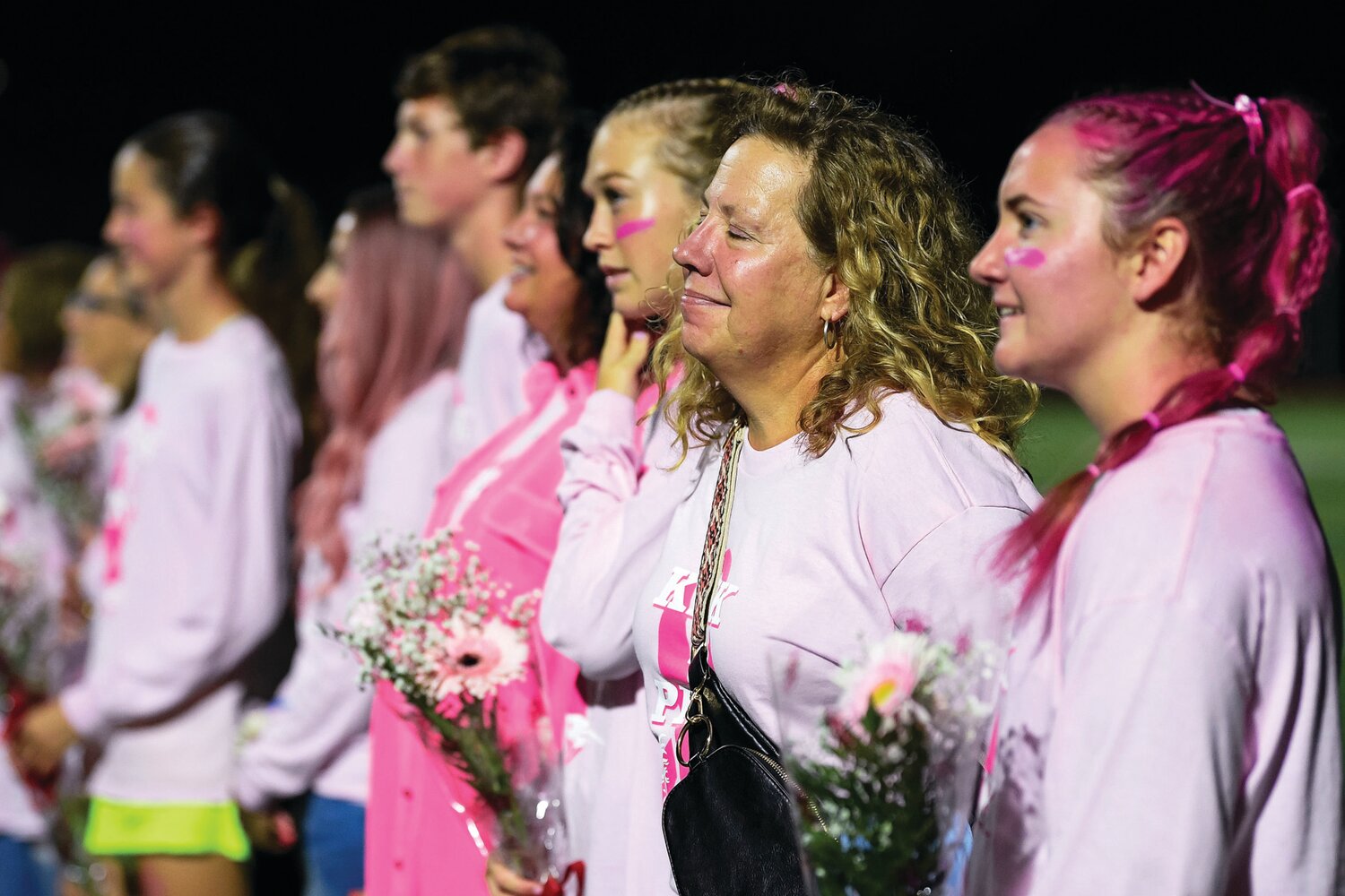 Meg Schumer is introduced before the start of the CB East-CB West girls soccer game. In between games both schools honored the breast cancer survivors for their efforts combating the disease.