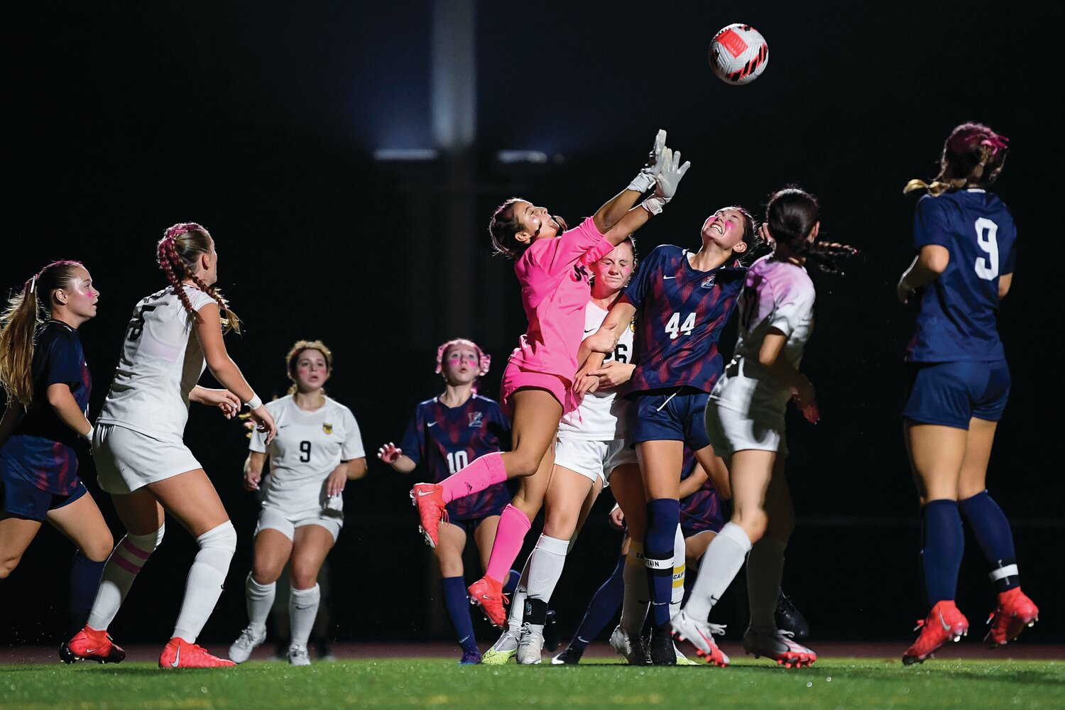 CB West goalie Camryn Nocito clears a corner kick in front of the goal during second half action.