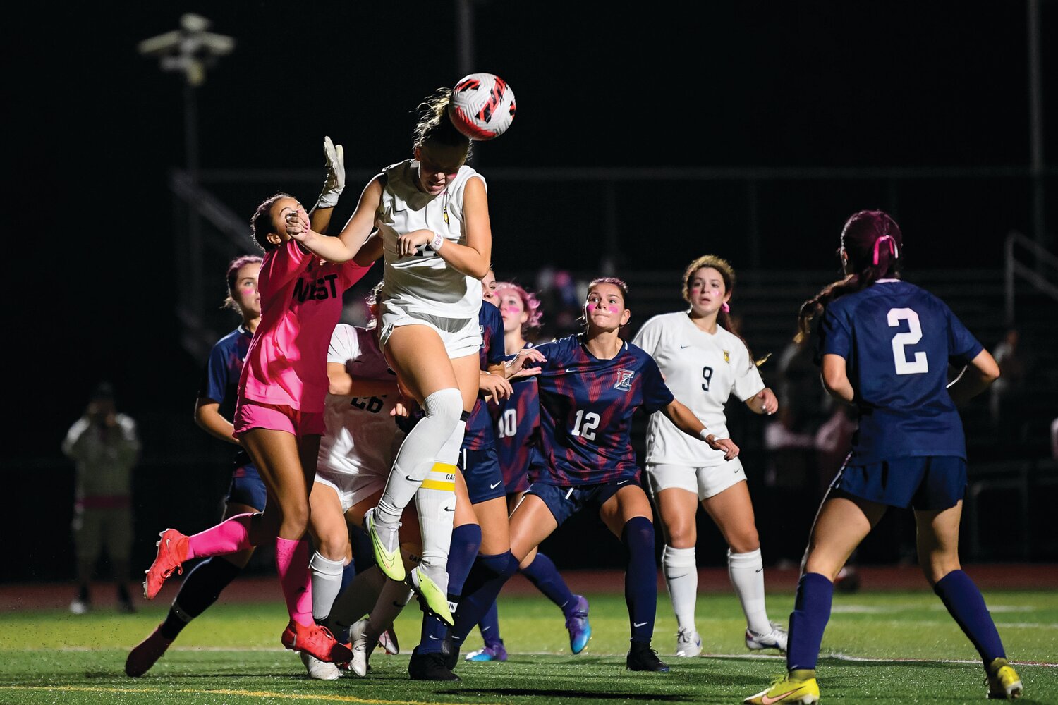 CB West’s Mackenzie Gausch clears the ball in front of the CB West goal with a header during the second half of the 0-0 tie.