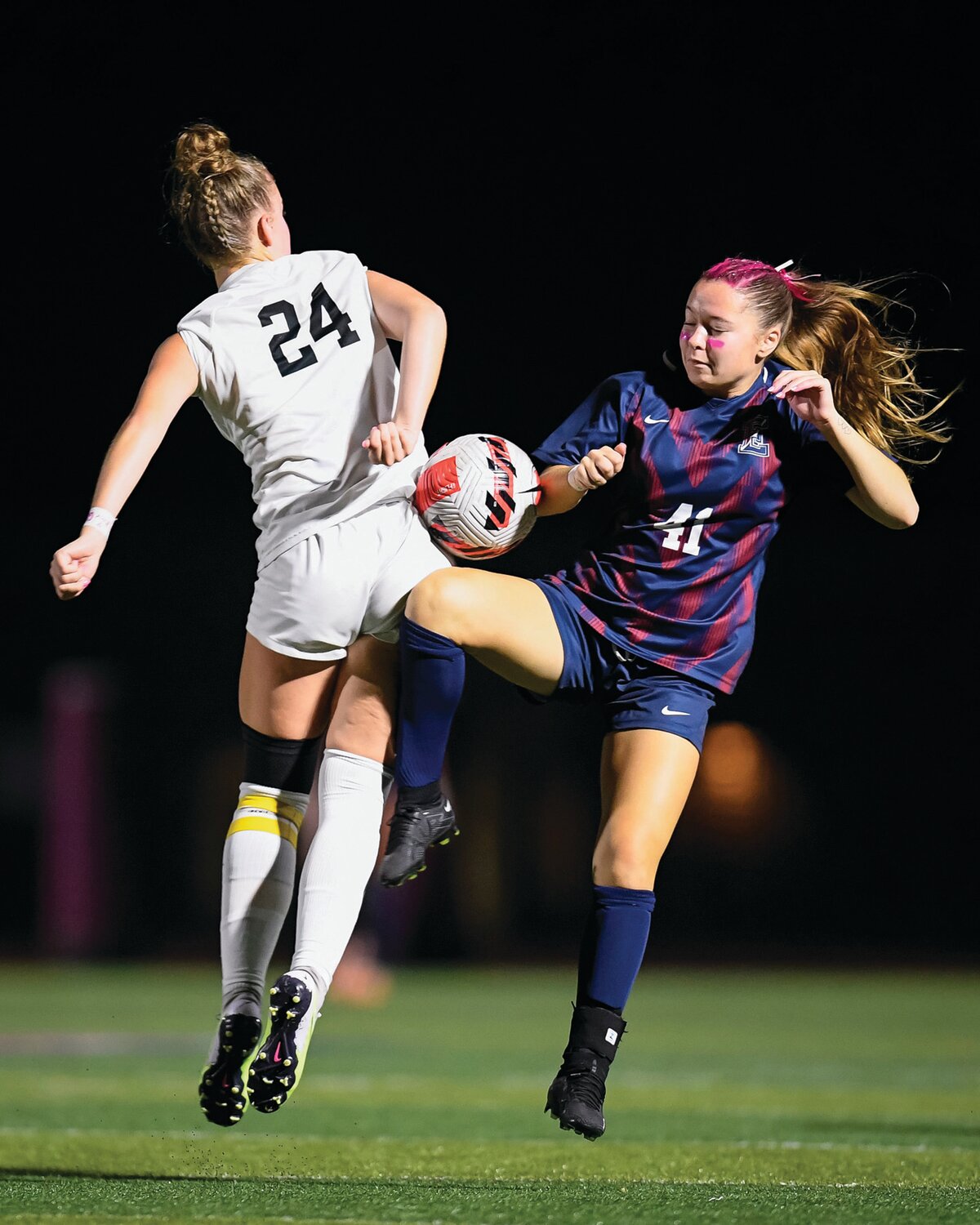 CB East’s Madelyn Hill gets in front of CB West’s Janelle Blokker to intercept a pass during the second half.