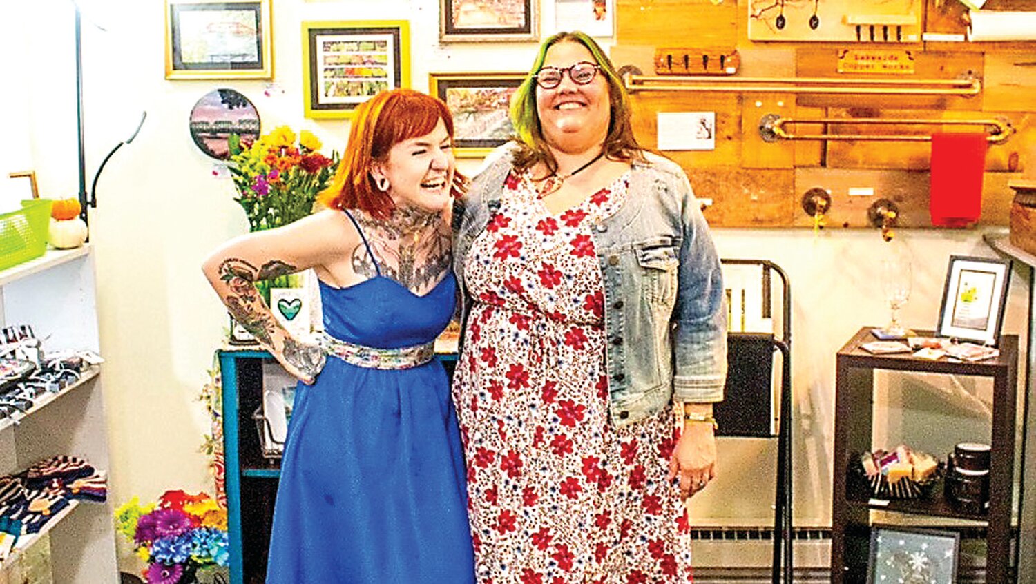 Hope Gaburo, left, and Erin Simmons share a laugh at Scrambled Gallery during Gaburo’s solo show in 2021.
