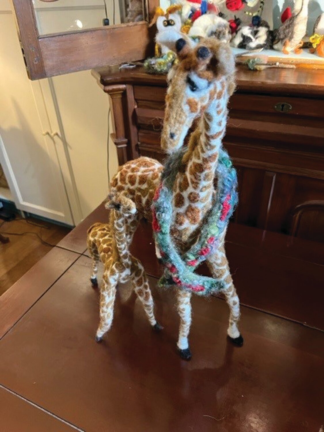 The giraffe took Gerry Mulloy so long to make — hours and hours  — she decided to keep it as her logo.