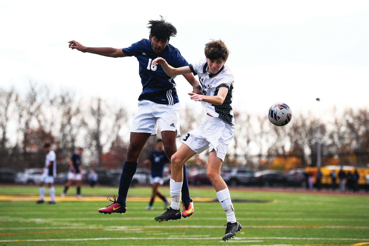 Council Rock North’s Keertan Palayam and La Salle’s Liam Pottichen battle for a corner kick pass in front of the La Salle goal during Saturday’s PIAA quarterfinal contest.
