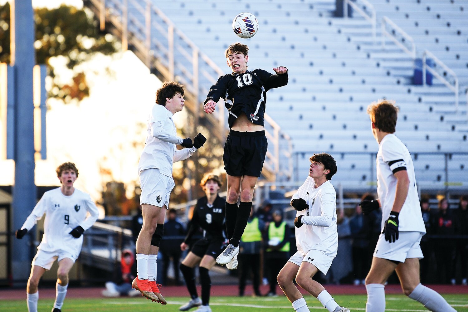 Faith Christian’s Logan Moore tries to redirect a corner kick to the goal during the first half.