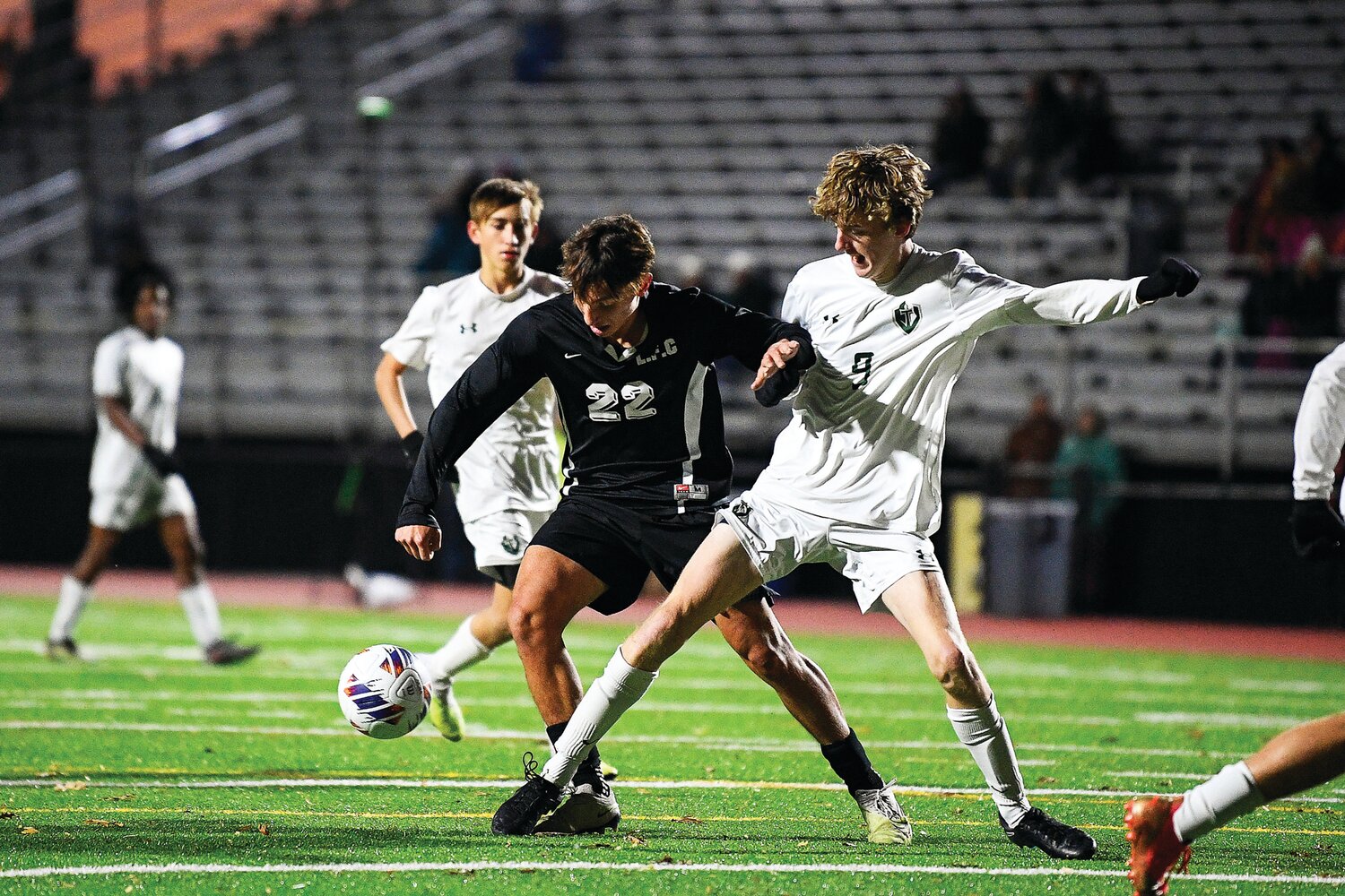 Faith Christian’s Guilherme Machado and Delco Christian’s Cameron Vavala tangle for a loose ball in front of the DC goal.