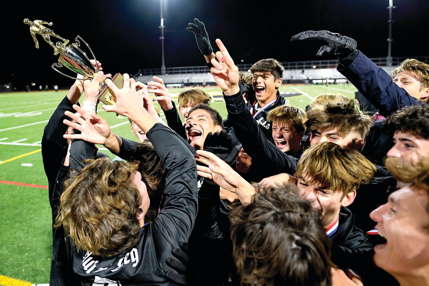 Faith Christian celebrates the district title after getting the trophy.