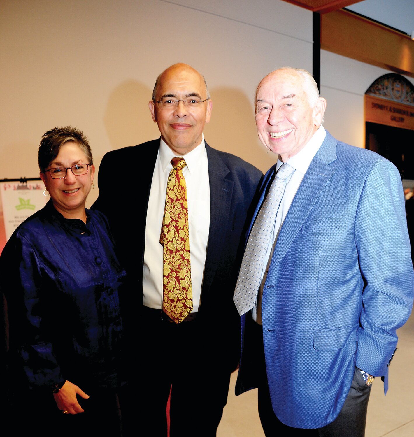 Marie and Larry Woodson stand with William Schutt.