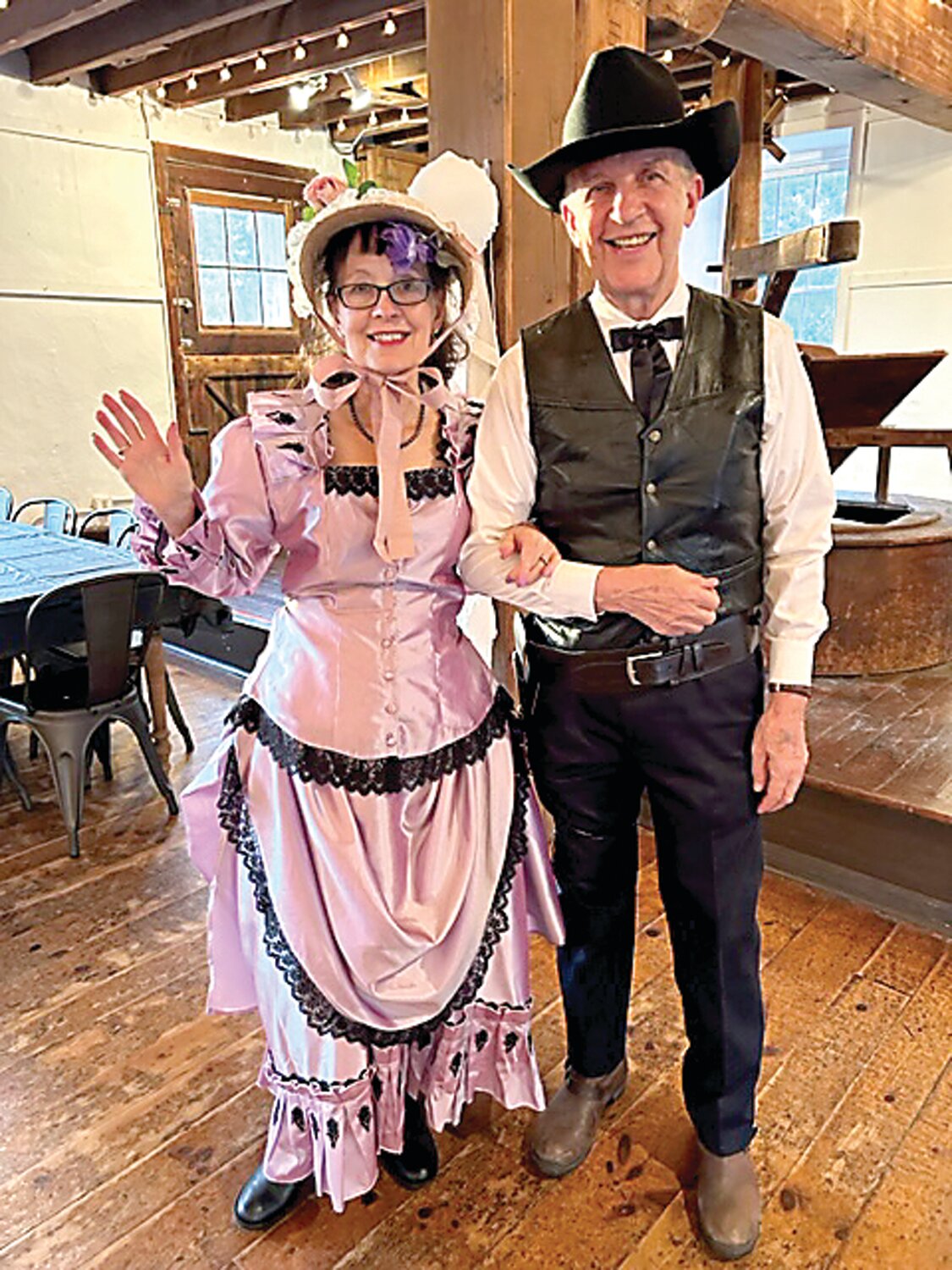 Hostess Geri Crilley Raymond and Jim Guerra as characters from “High Noon.”