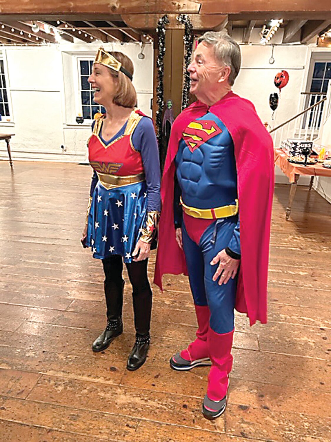 Denise and Don Tripp as Superman and Wonder Woman.