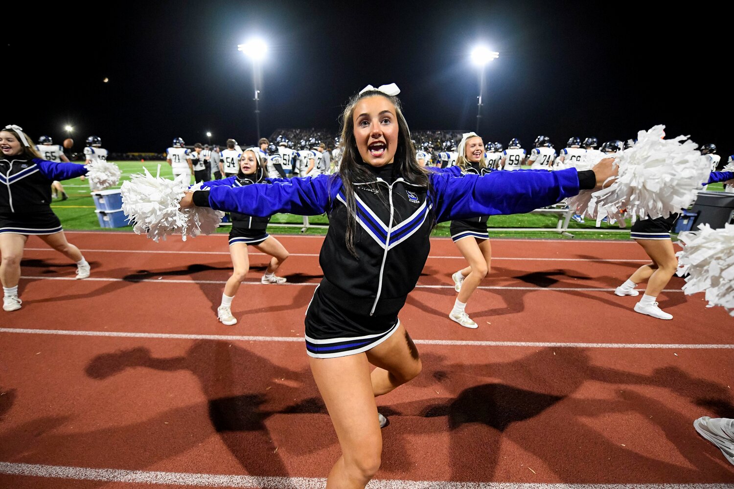 Central Bucks South cheer captain Sydney Loeb leads the cheerleaders during kickoff.