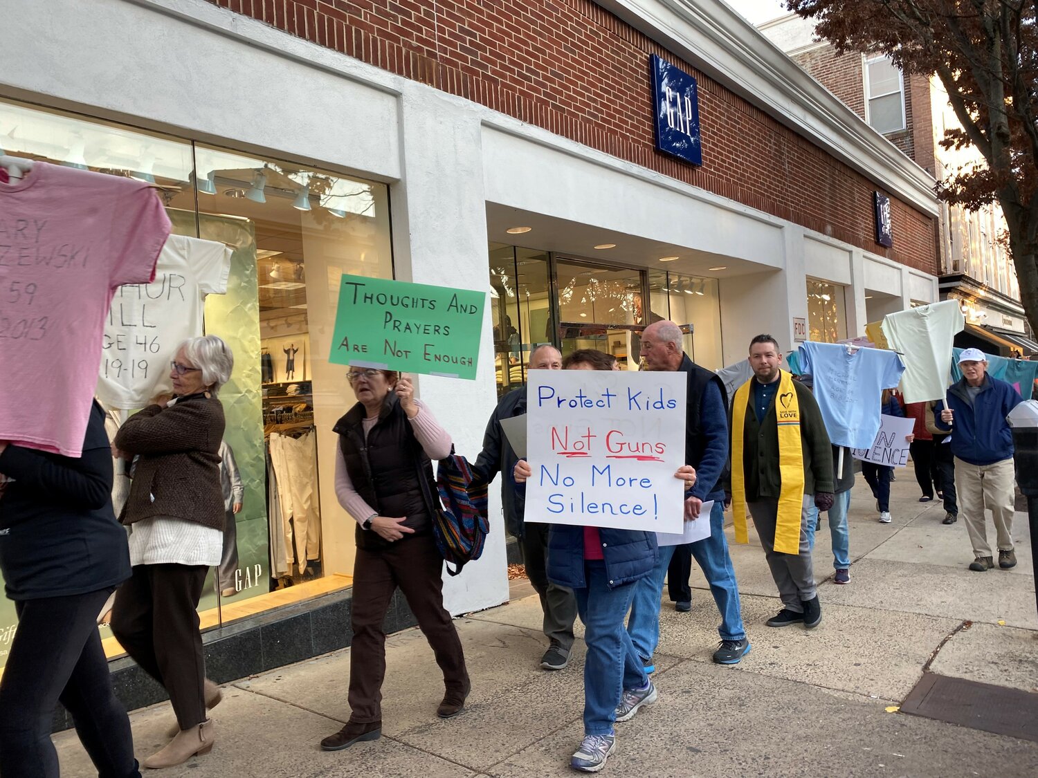 Following an interfaith worship program, about 100 people walked through Doylestown Borough Sunday drawing attention to the need for an end to gun violence through public education, legislation and advocacy.