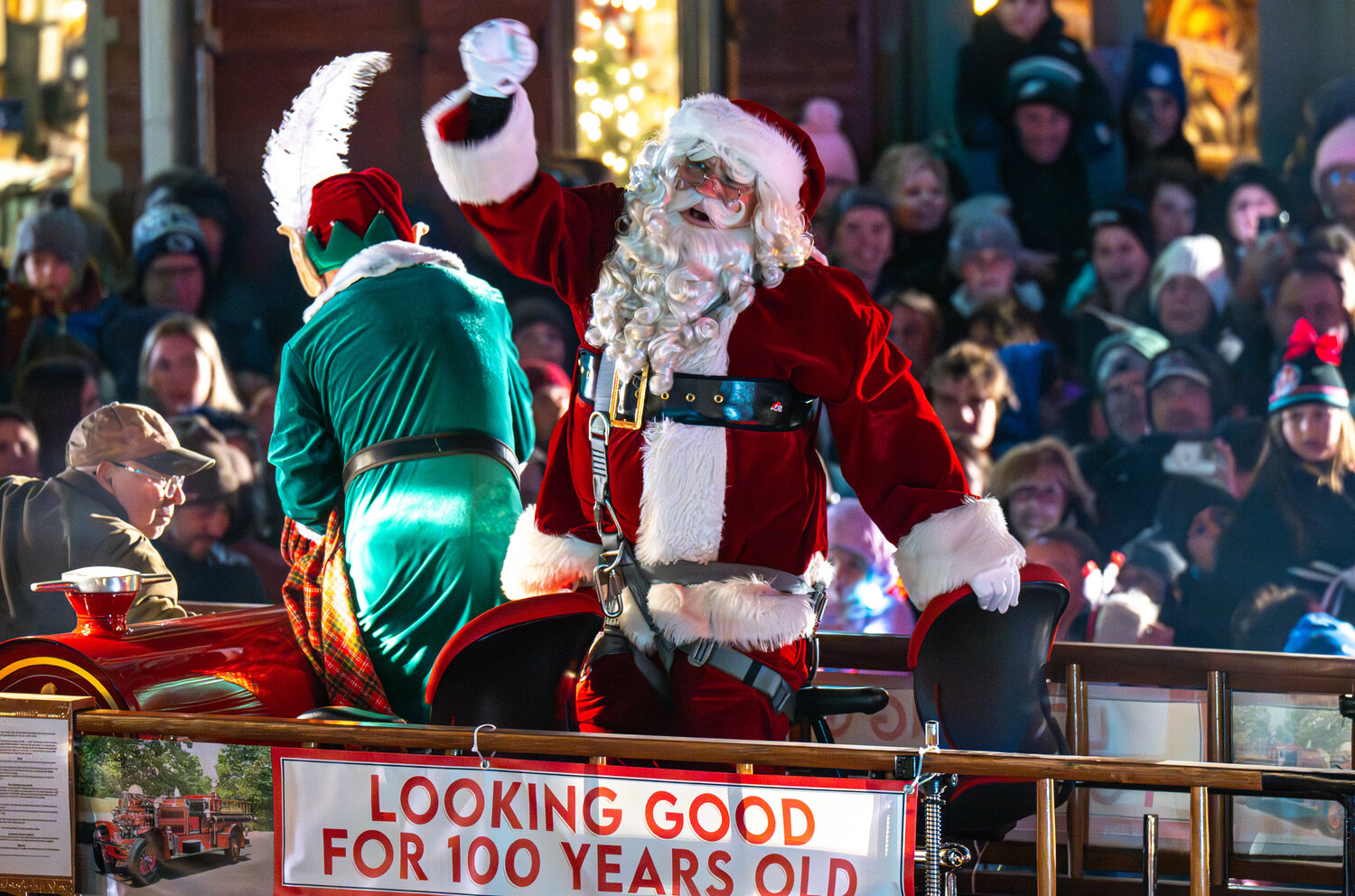Santa Claus waves to the crowd at Doylestown Winterfest Friday. He arrived on Doylestown Fire Co.’s classic fire truck, the Ahrens “Fox” Pumper, which the company purchased in 1923.
