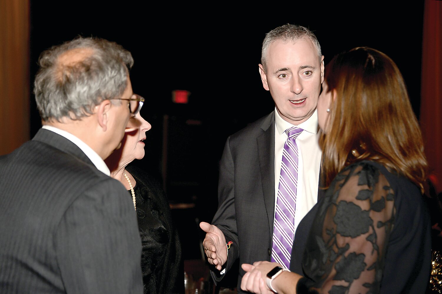 U.S. Rep. Brian Fitzpatrick speaks with other attendees at the Lower Bucks County Chamber of Commerce’s celebration of its 2023 Champions of Commerce award winners on Nov. 16 at The Fuge in Warminster.