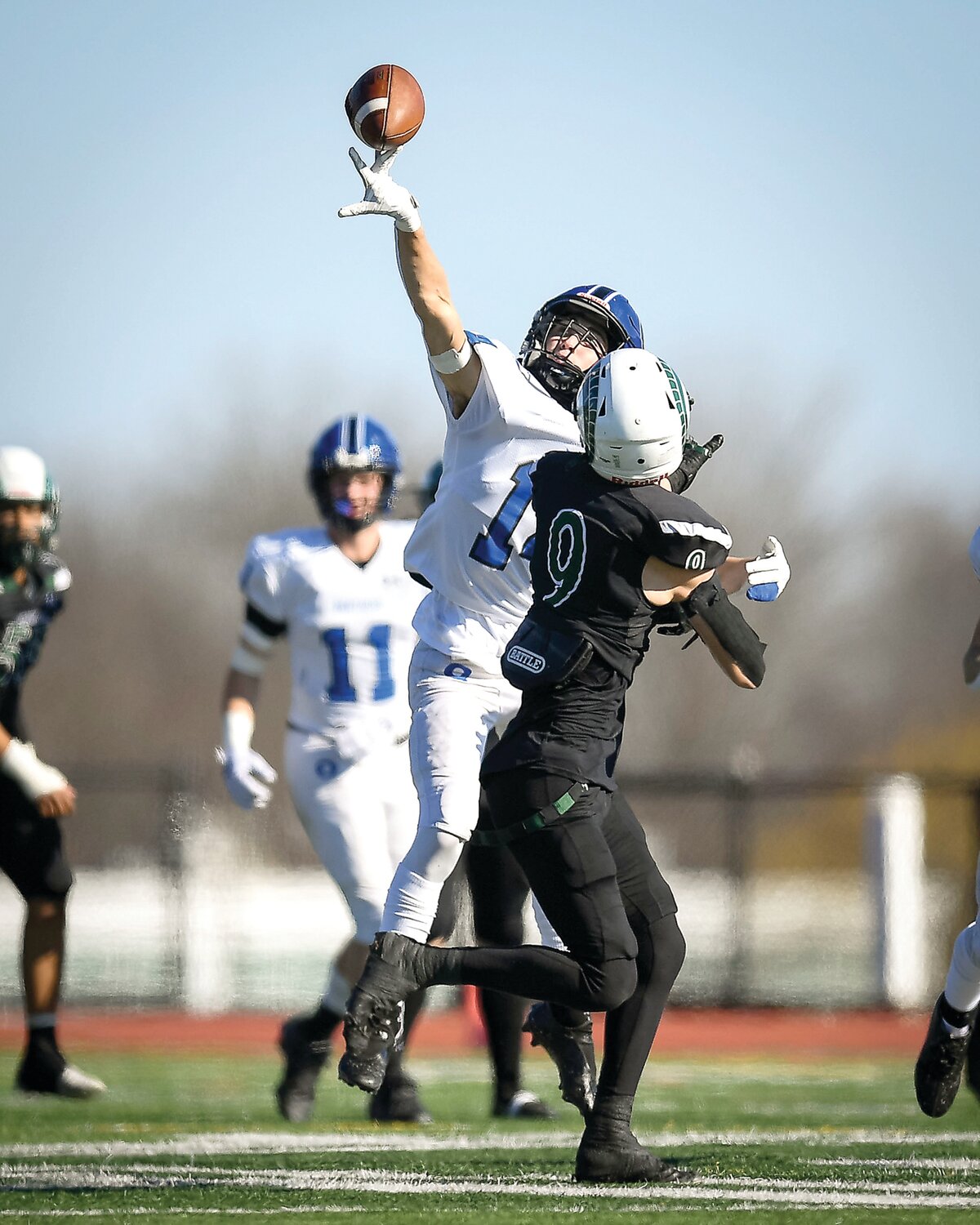 Quakertown’s Reagan Payne just gets a hand on the ball to tip a pass attempt to Pennridge’s Joe Gregorie.