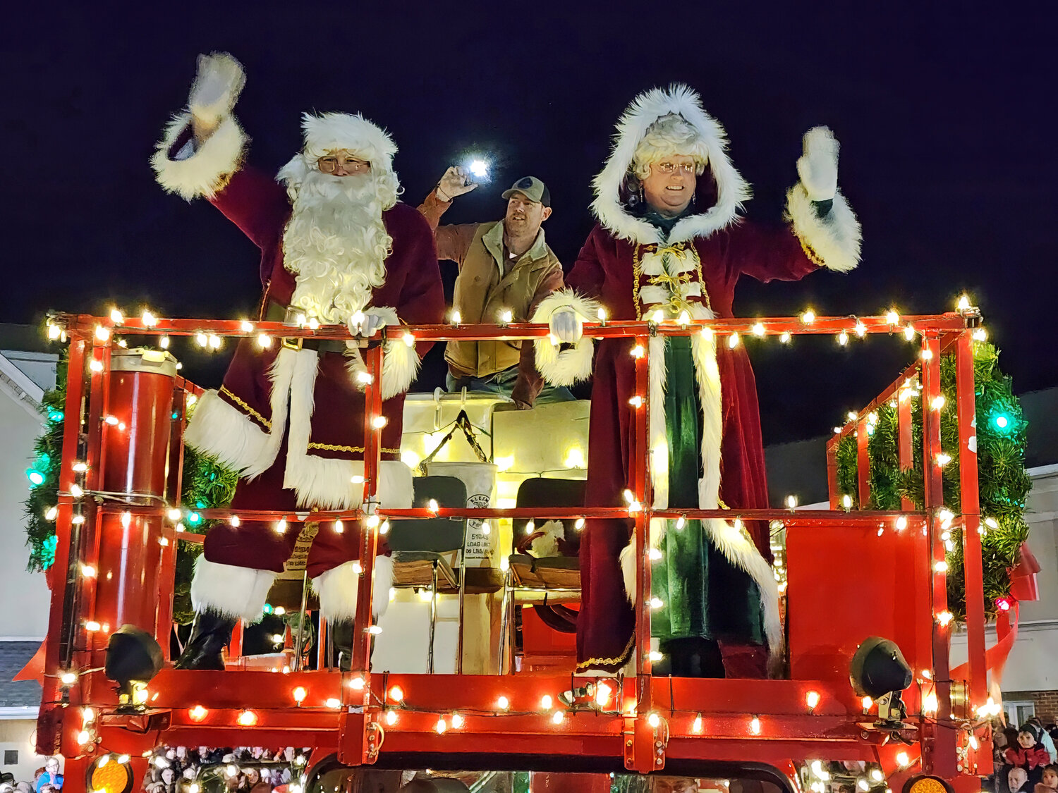Santa and Mrs. Claus roll into Perkasie on a decorated fire truck.